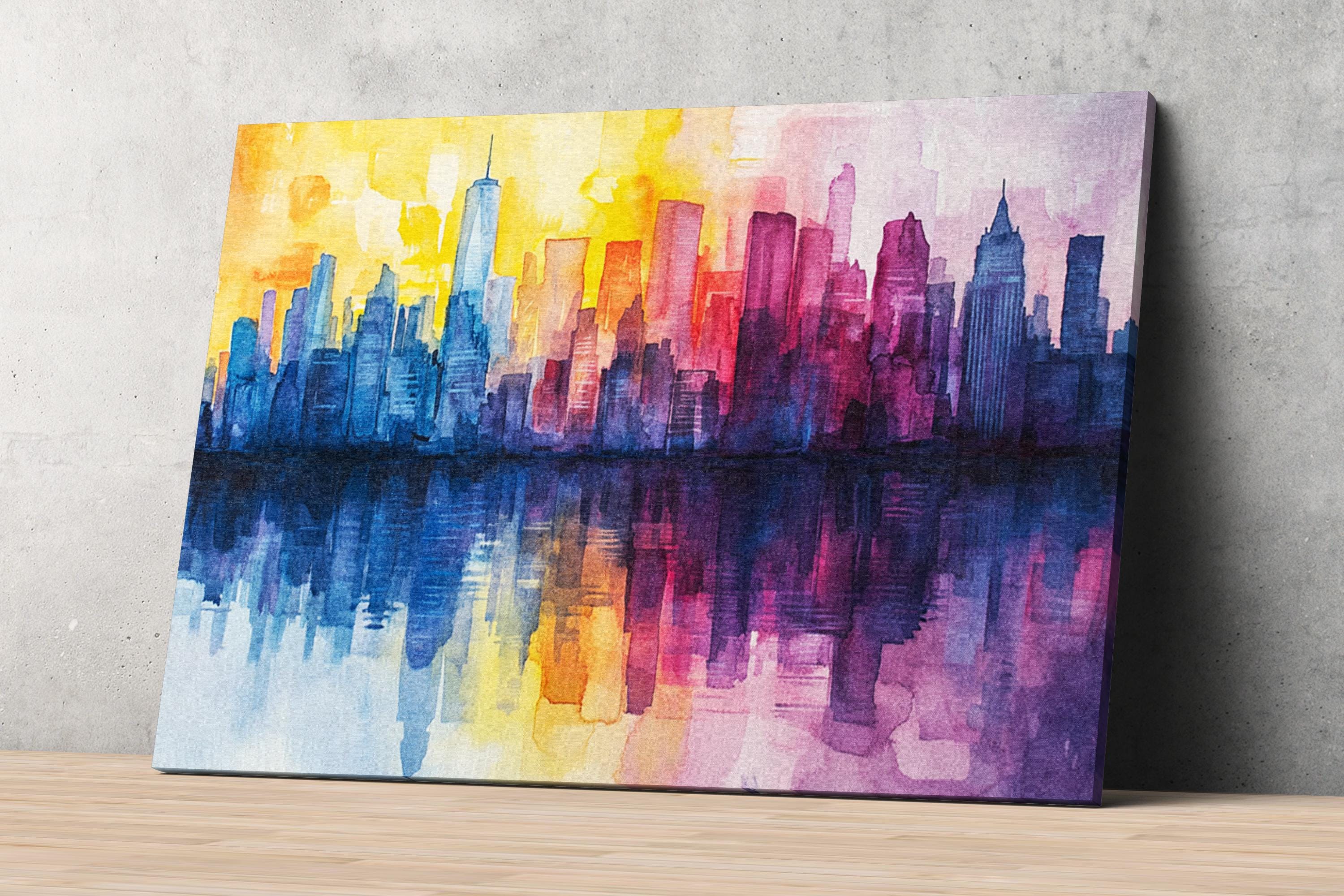 A vibrant watercolor painting depicting a city skyline with tall buildings in various colors, including blue, orange, and purple, reflected in a body of water below.