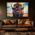 a large painting of a bison with horns, hanging on a wall above a brown leather couch in a living room setting.
