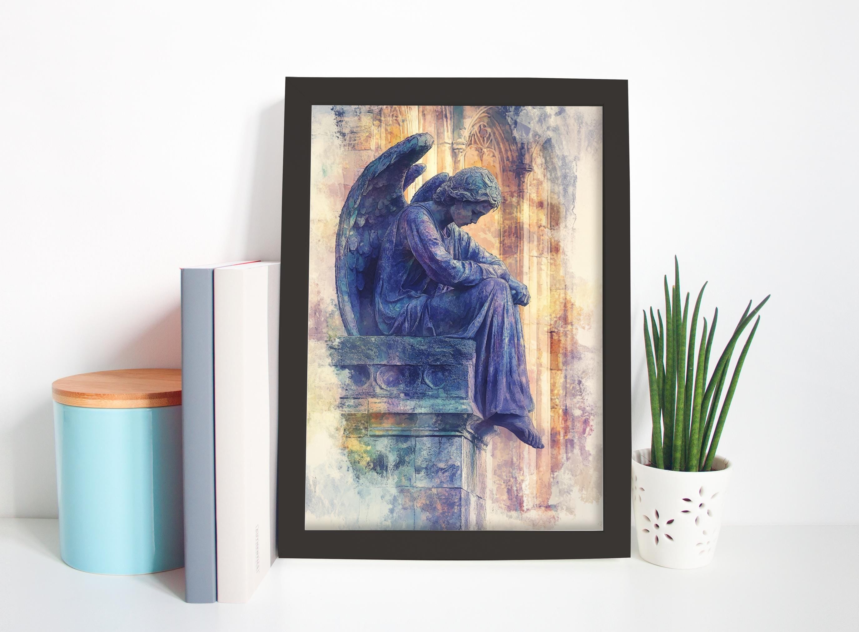a framed painting of a statue of an angel sitting on a pedestal, with a potted plant and some books placed next to it on a shelf.