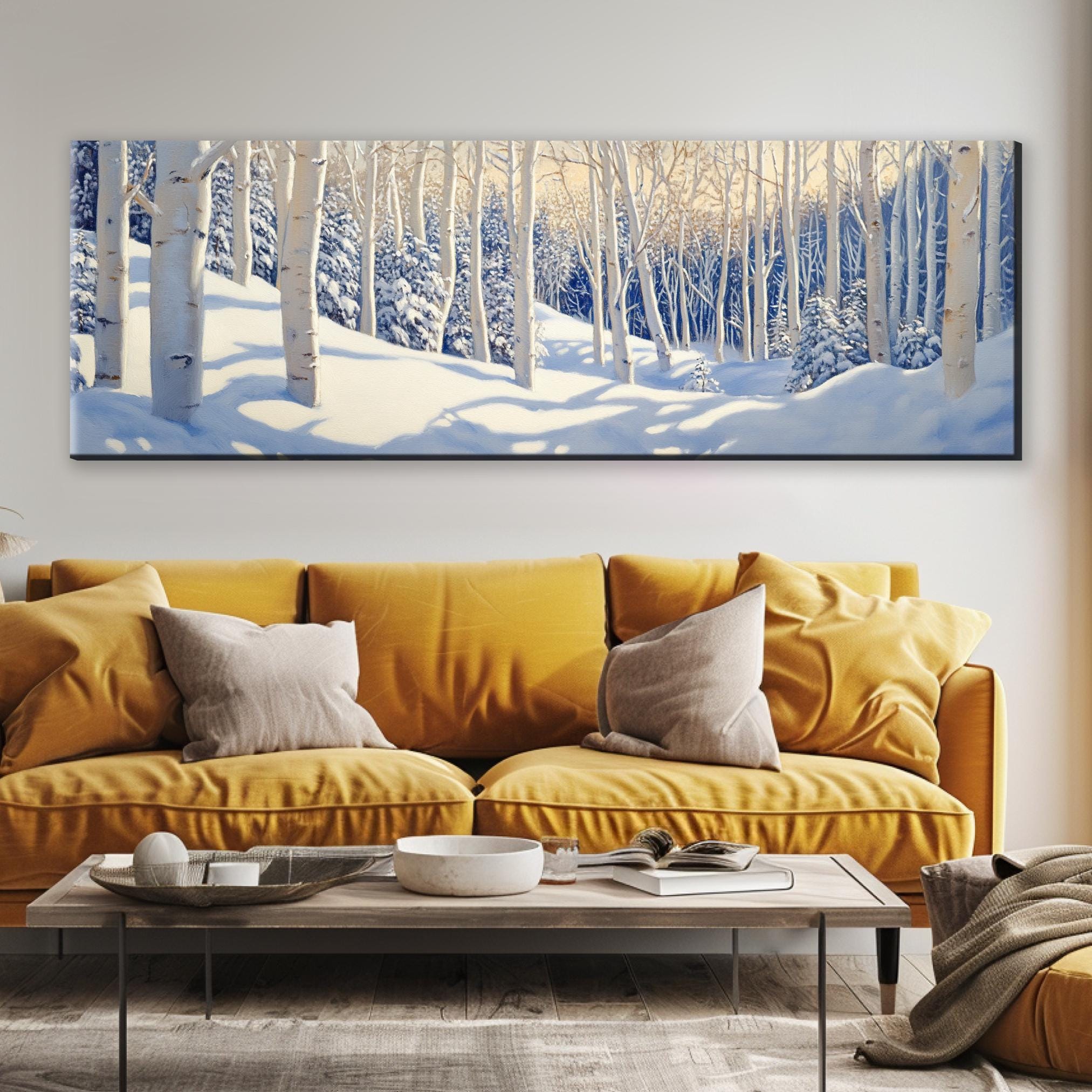 a living room with a yellow couch and a painting on the wall