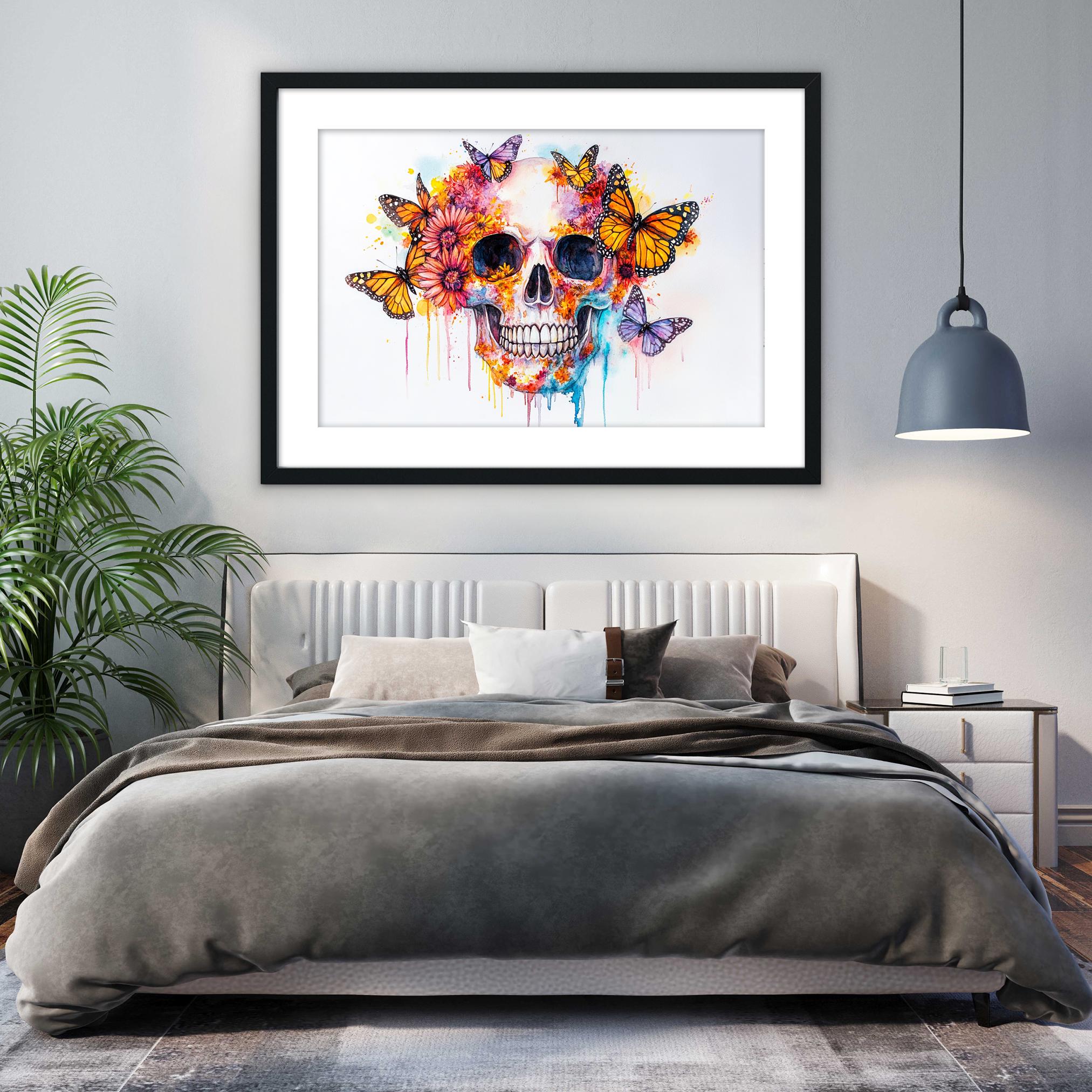 a bedroom with a large bed, a framed artwork of a colorful skull with butterflies hanging above it, and a potted plant to the left.