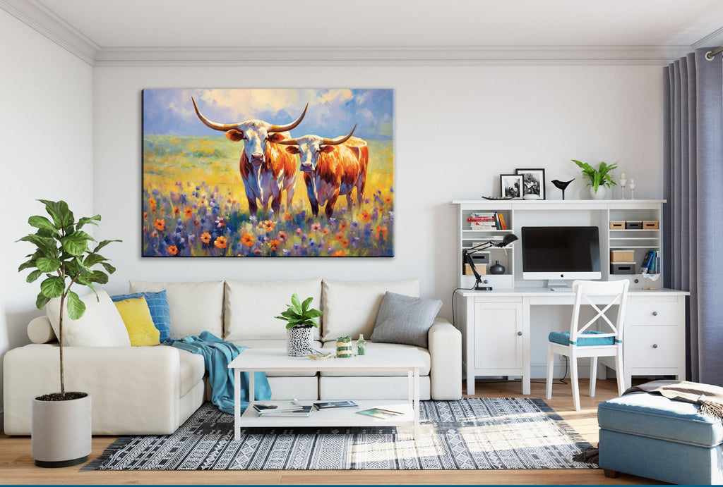 a cozy living room with a large painting of two cows in a field hanging on the wall. The room is furnished with a white sofa, a coffee table, and a desk with a computer setup. The room also features a potted plant, a vase, and a bookshelf, creating a warm and inviting atmosphere.