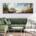 a living room with a green couch and a painting on the wall