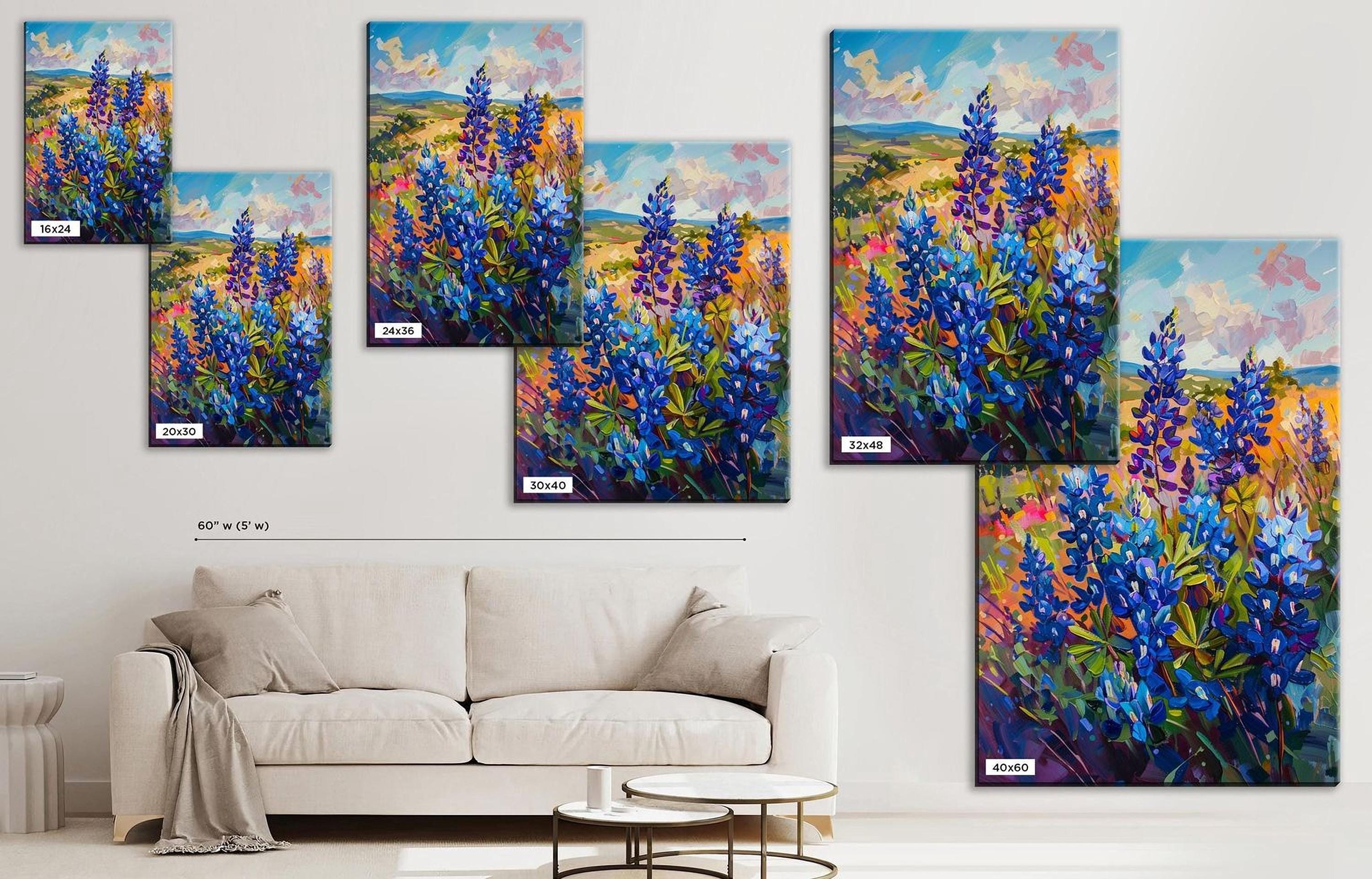 The image is a collage of six paintings depicting vibrant blue flowers in a field, arranged on a wall above a white couch in a living room setting.