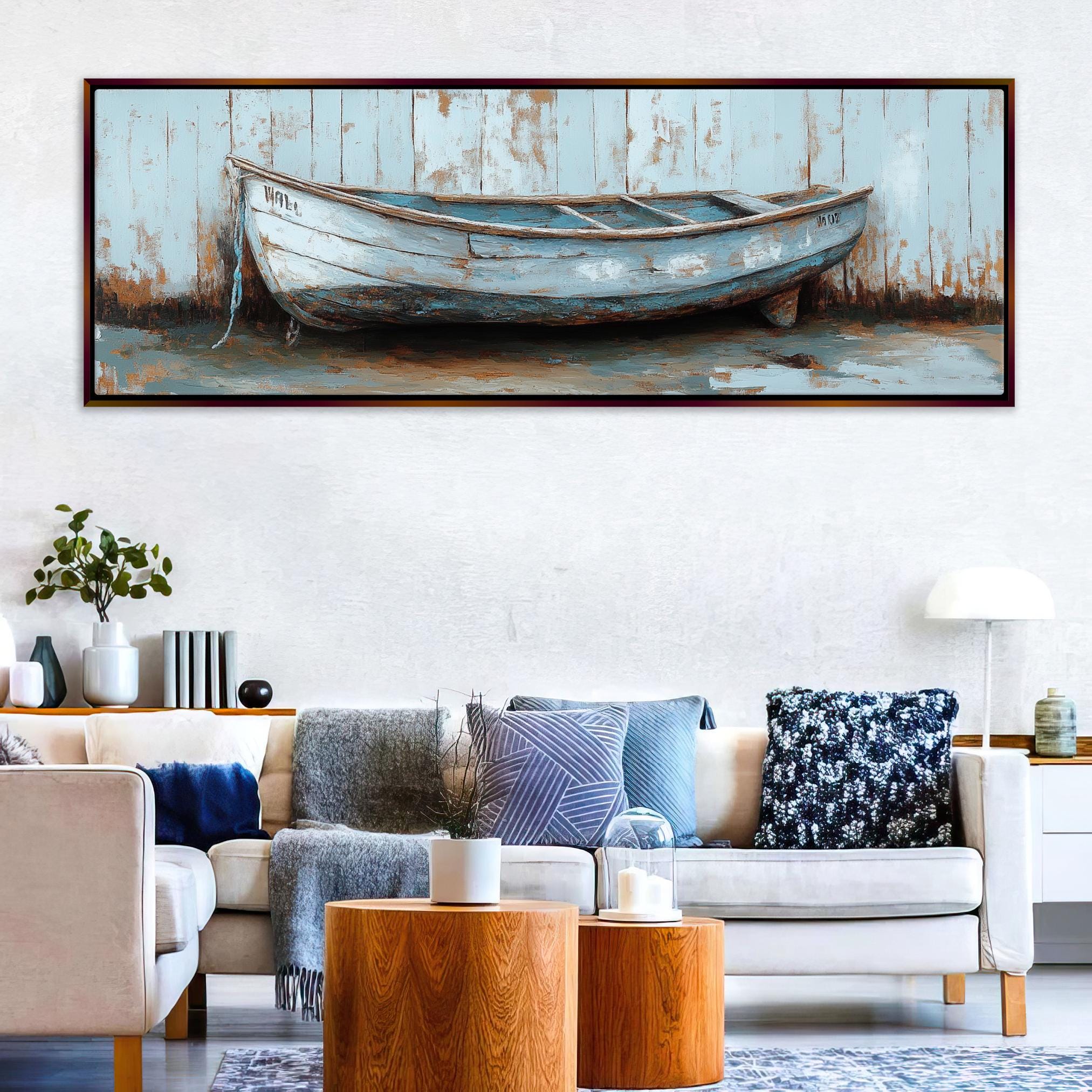 a living room with a couch and a painting on the wall