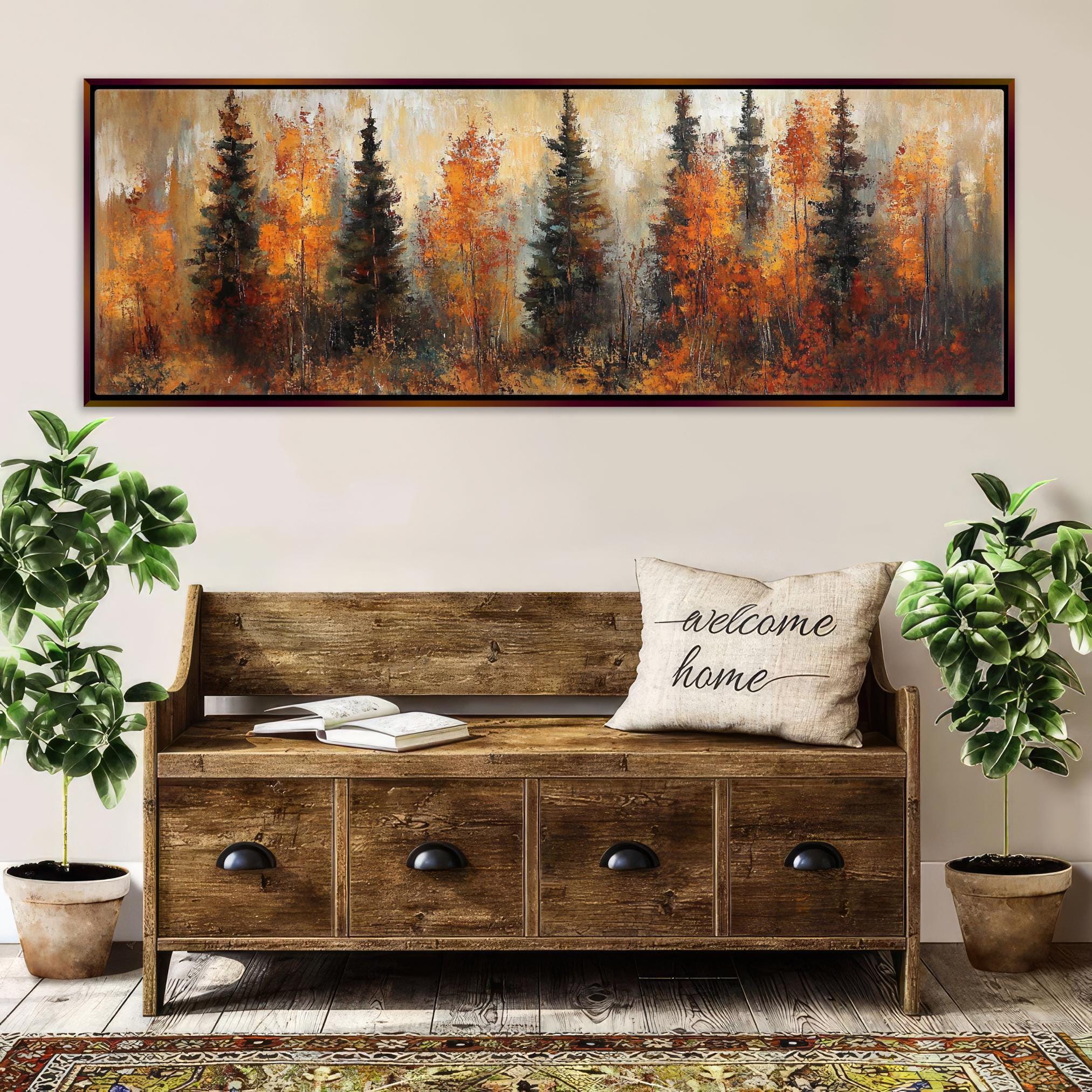 a wooden bench with a "welcome home" pillow, surrounded by potted plants and a large painting of a forest scene above it.