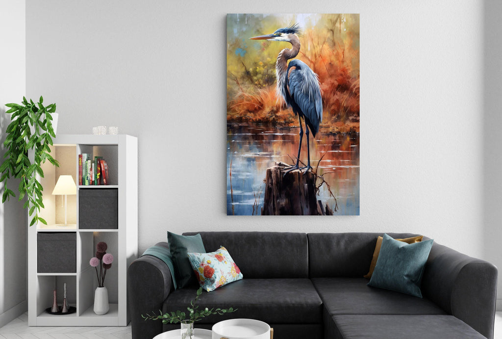 a large painting of a blue heron standing on a tree stump, hanging on a wall above a gray sectional sofa with colorful throw pillows.
