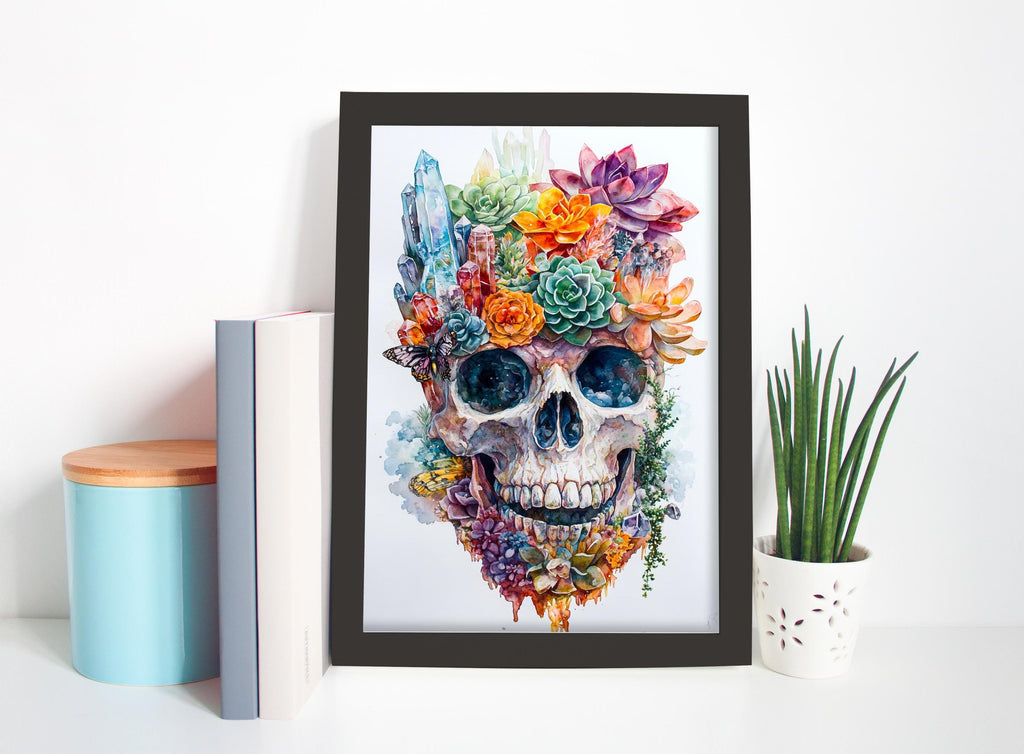 a framed artwork of a colorful skull with flowers and plants adorning its face, placed on a shelf next to a blue container and a potted plant.