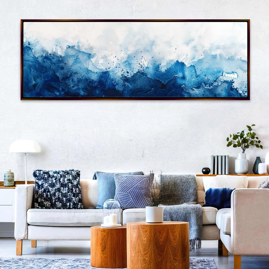 a living room filled with furniture and a painting on the wall