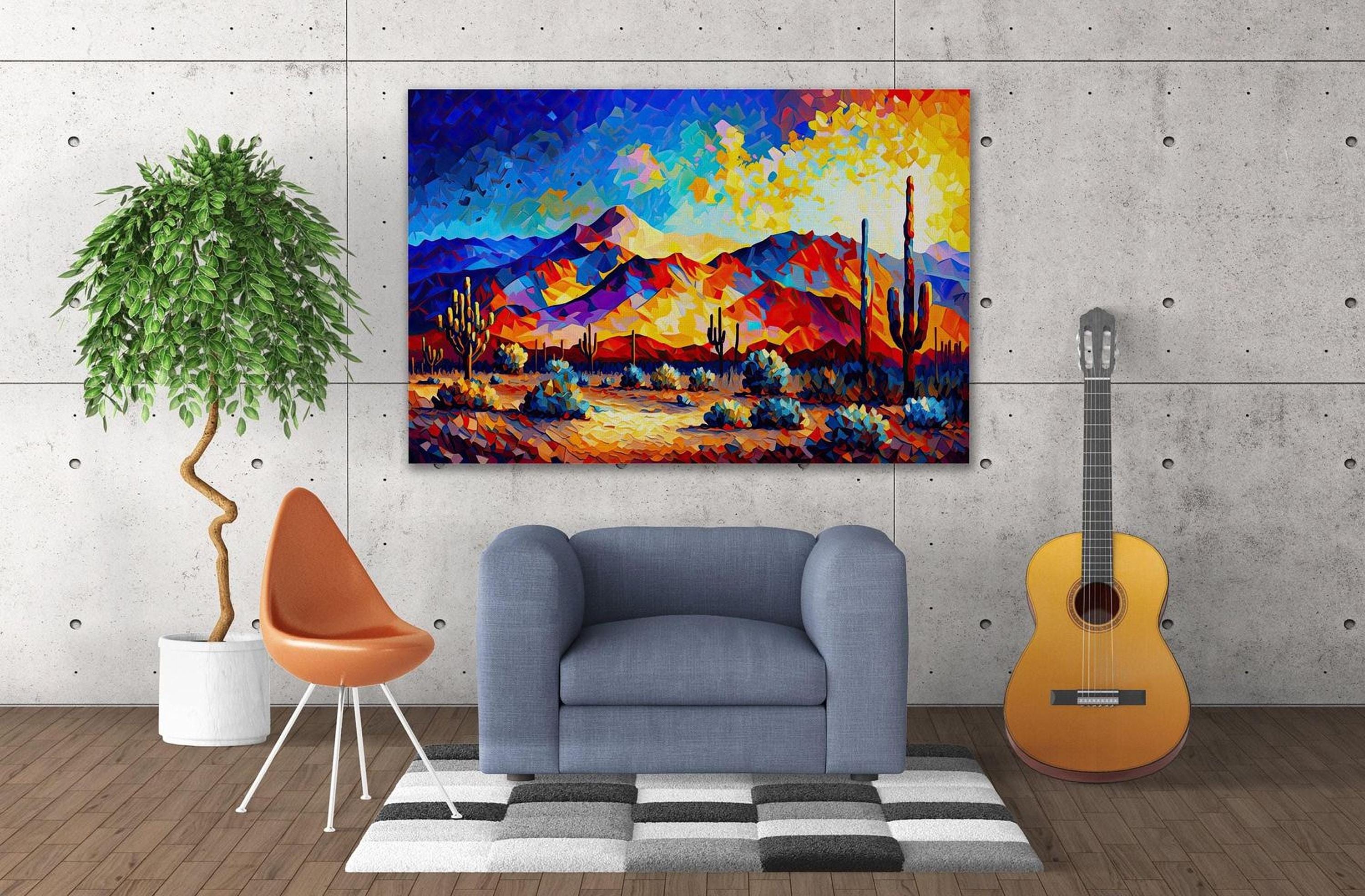 a modern living room with a large, colorful painting of a desert landscape hanging on the wall. The painting is vibrant with warm hues of orange, yellow, and blue, depicting a desert scene with mountains in the background. The room is furnished with a blue armchair, a wooden chair, and a guitar, creating a cozy and inviting atmosphere.