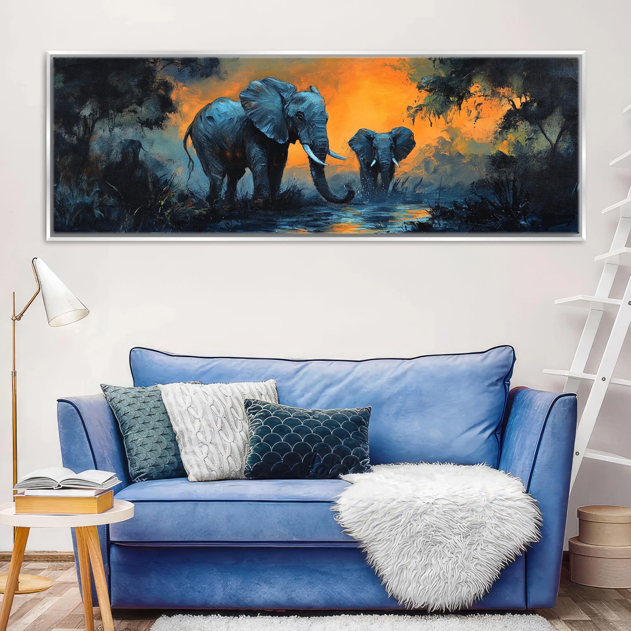 a painting of two elephants on a wall above a blue couch