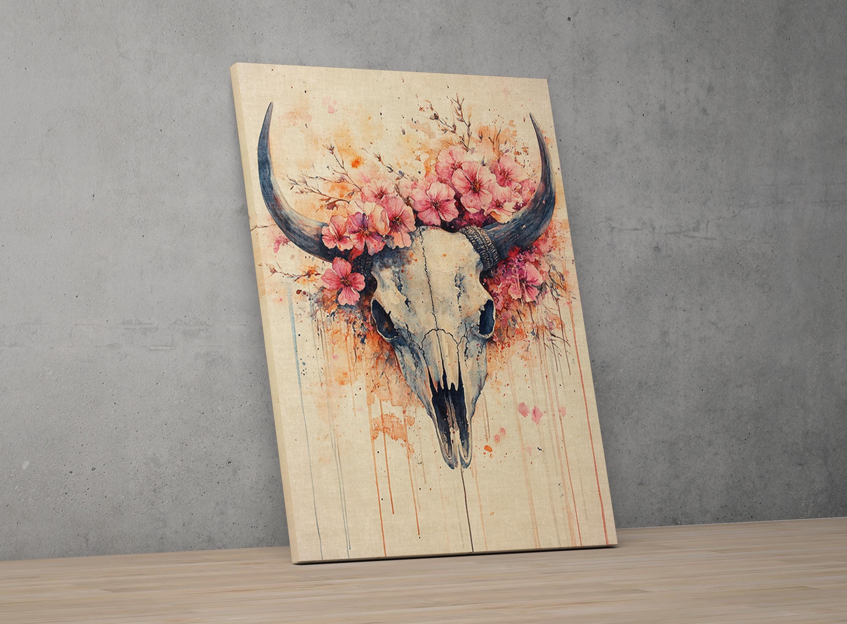 a skull with large horns and a floral wreath around it, set against a gray wall.