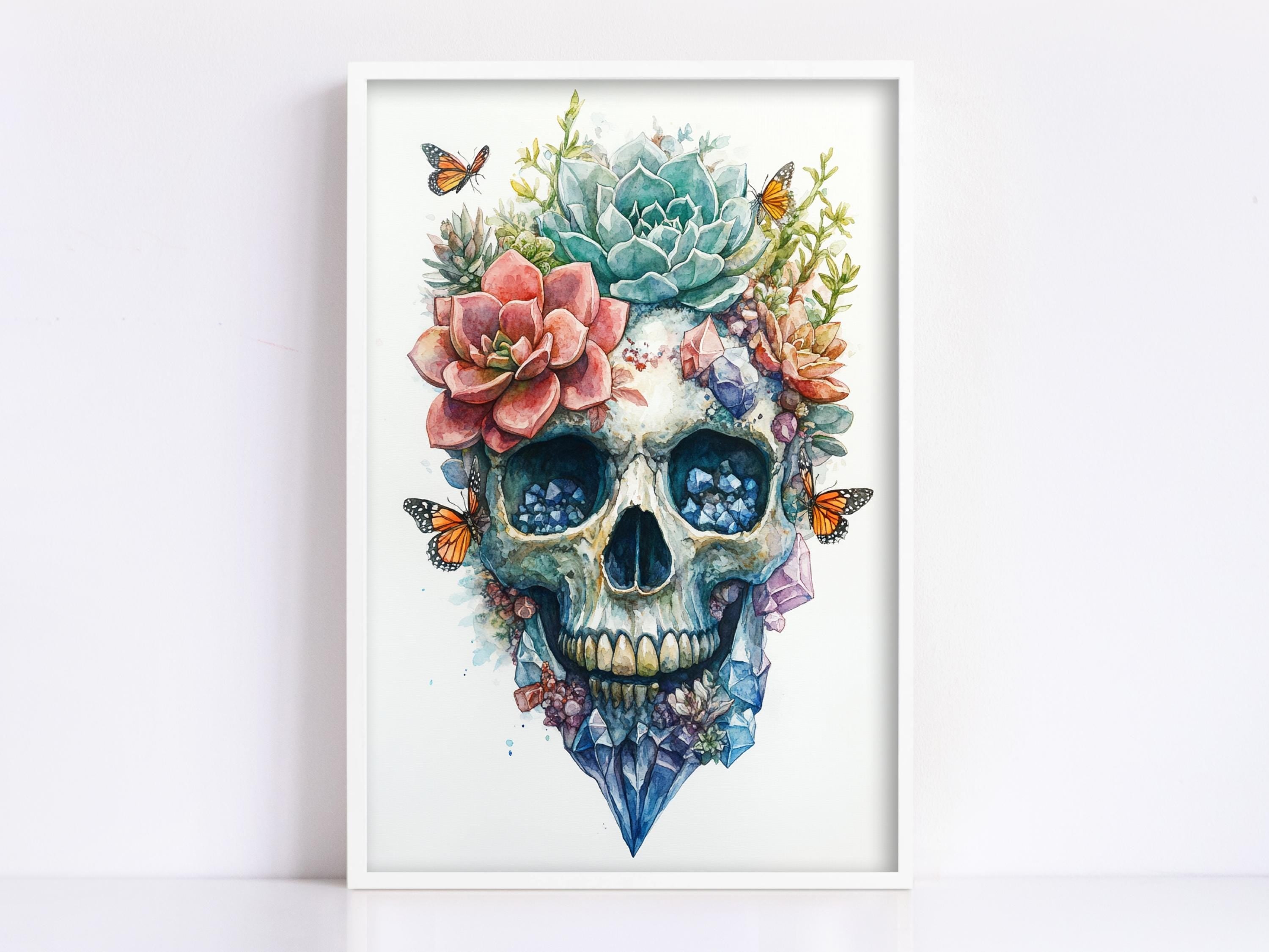 a skull with a floral arrangement on top of it, including a pink flower, a blue flower, and butterflies.