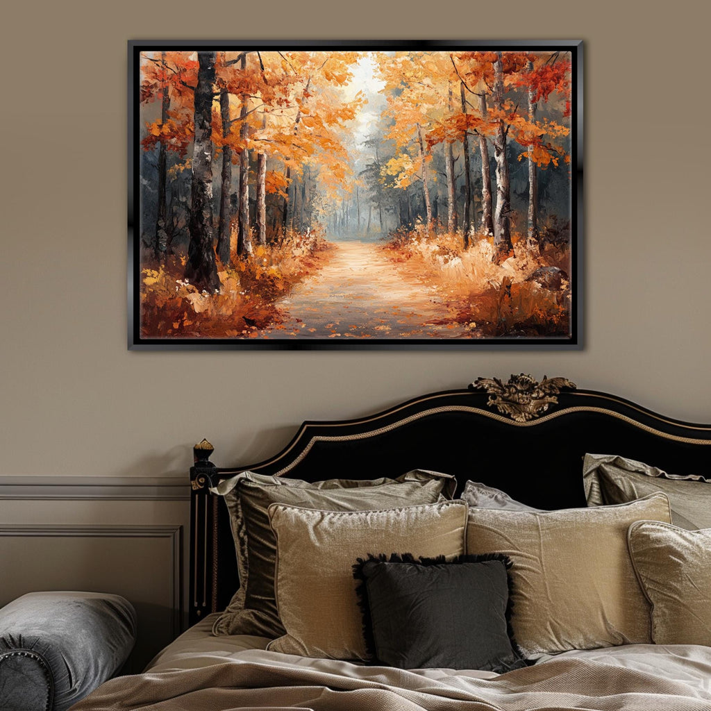 a large painting of a forest path with autumn trees hanging over the top of a bed in a bedroom setting.