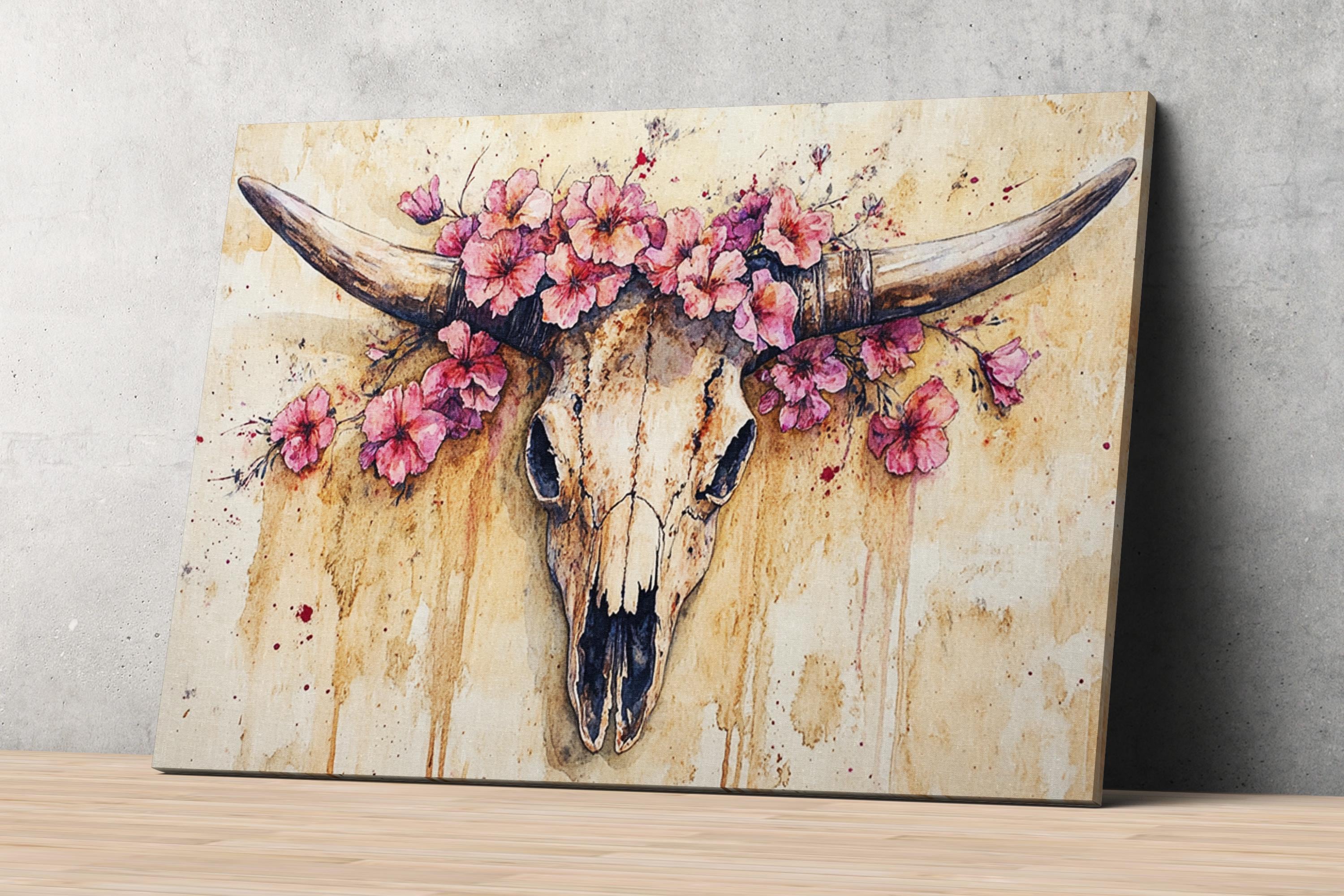 a painting of a skull with horns adorned with pink flowers.