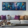 a living room with a couch and a painting on the wall