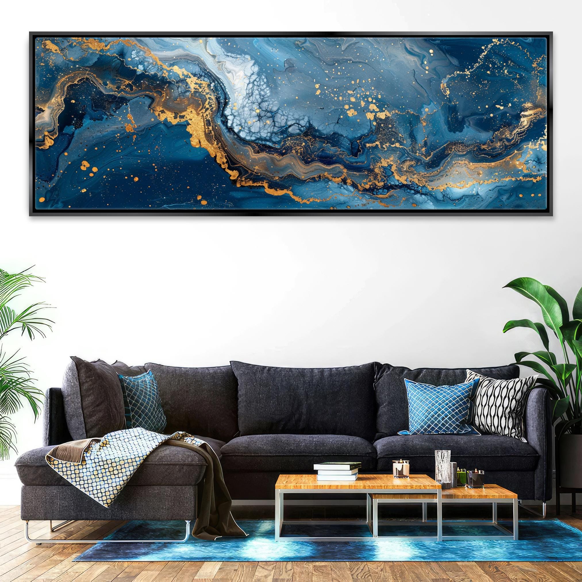 a living room with a couch and a painting on the wall