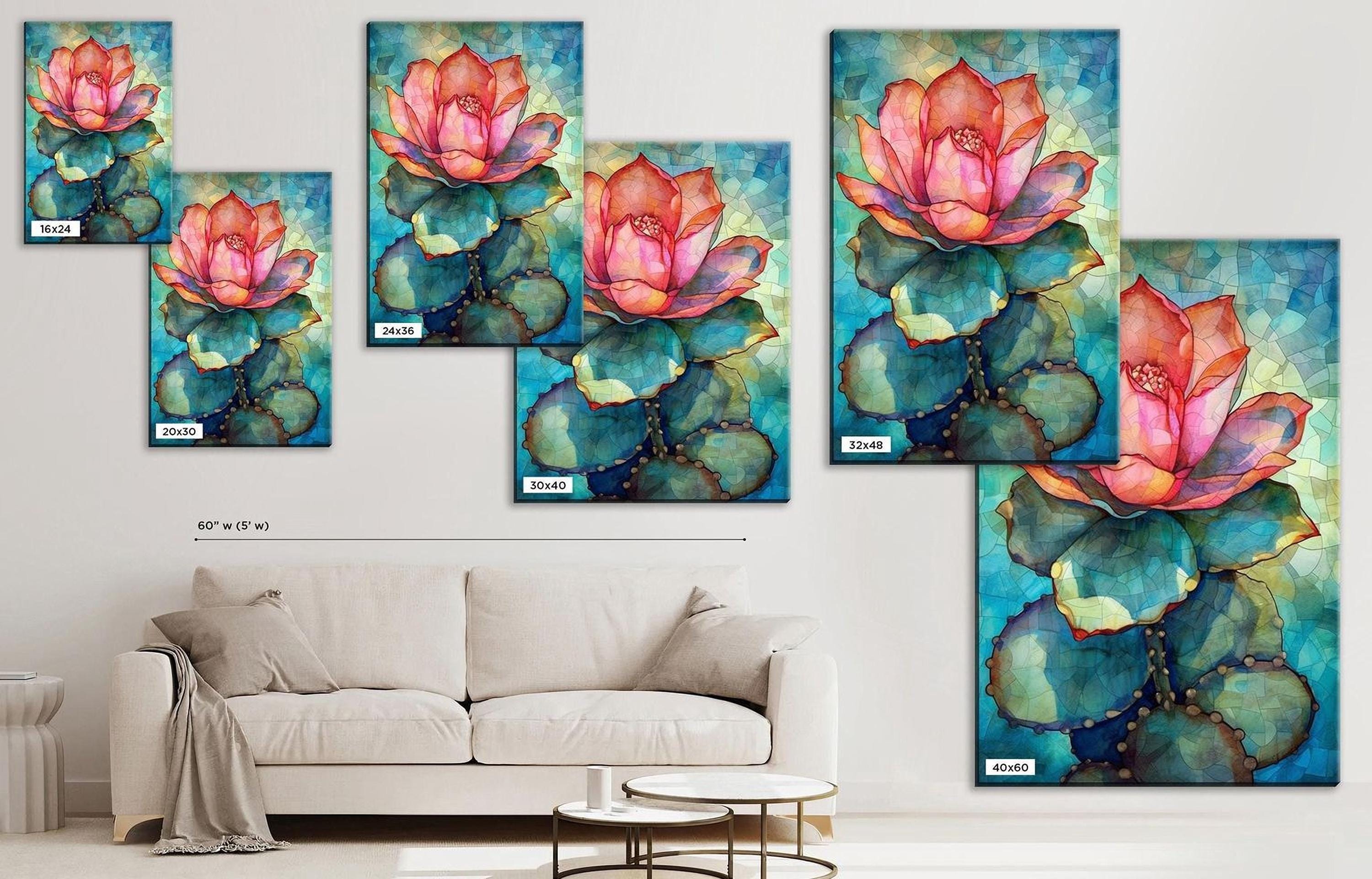 The image is a living room with a white sofa and a coffee table. There are several framed paintings of cactus flowers hanging on the wall above the sofa. The paintings feature vibrant colors and detailed depictions of the cacti and flowers.