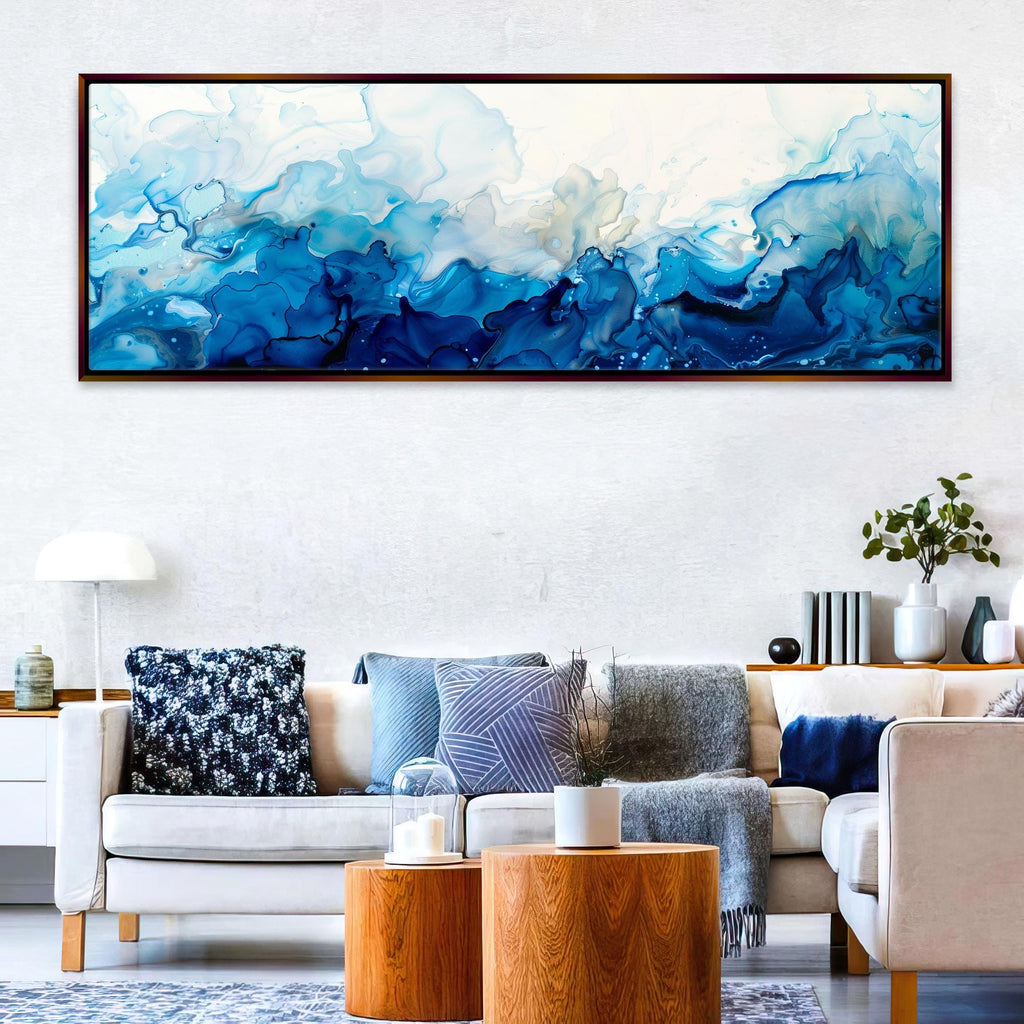 a living room filled with furniture and a painting on the wall