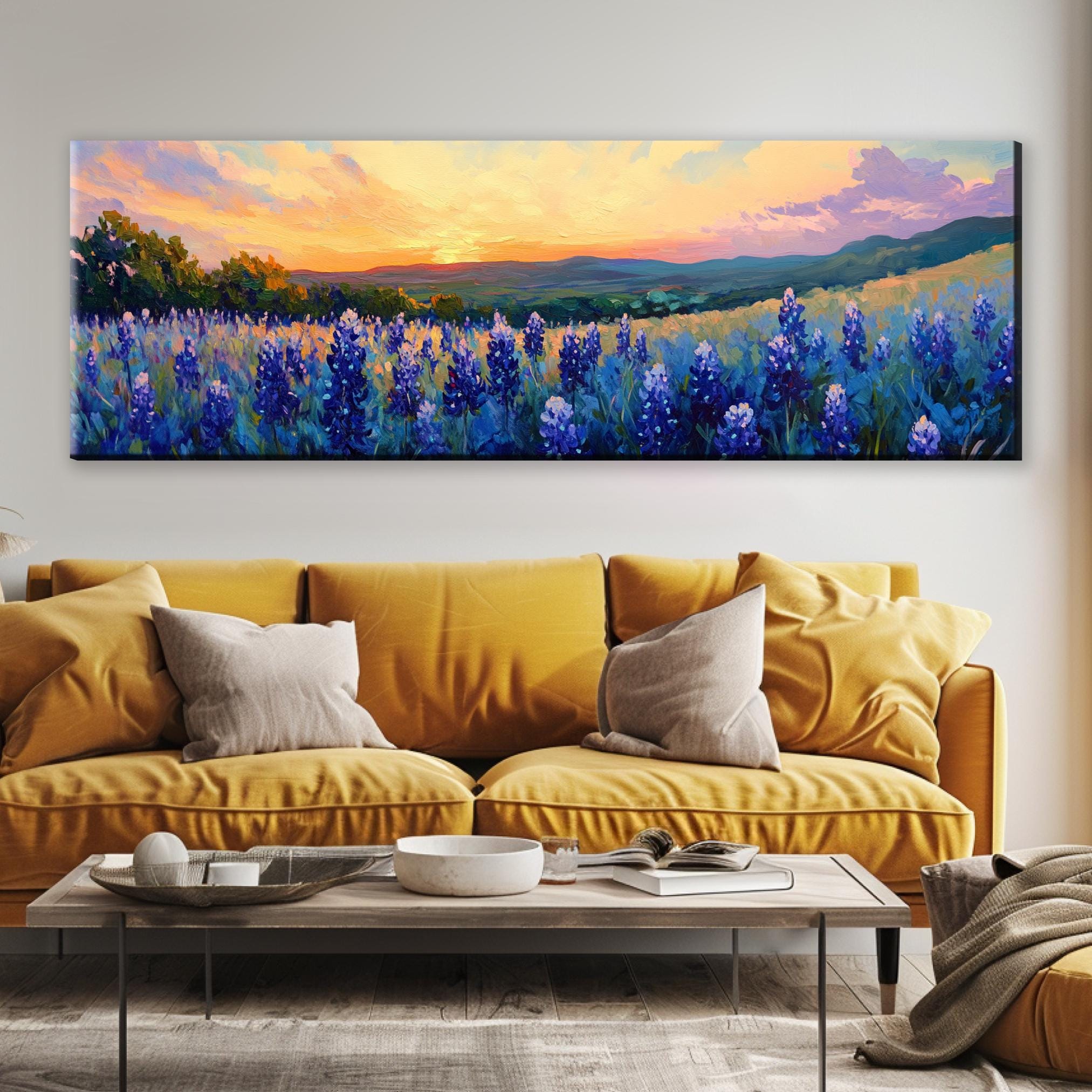 a living room with a couch and a painting on the wall