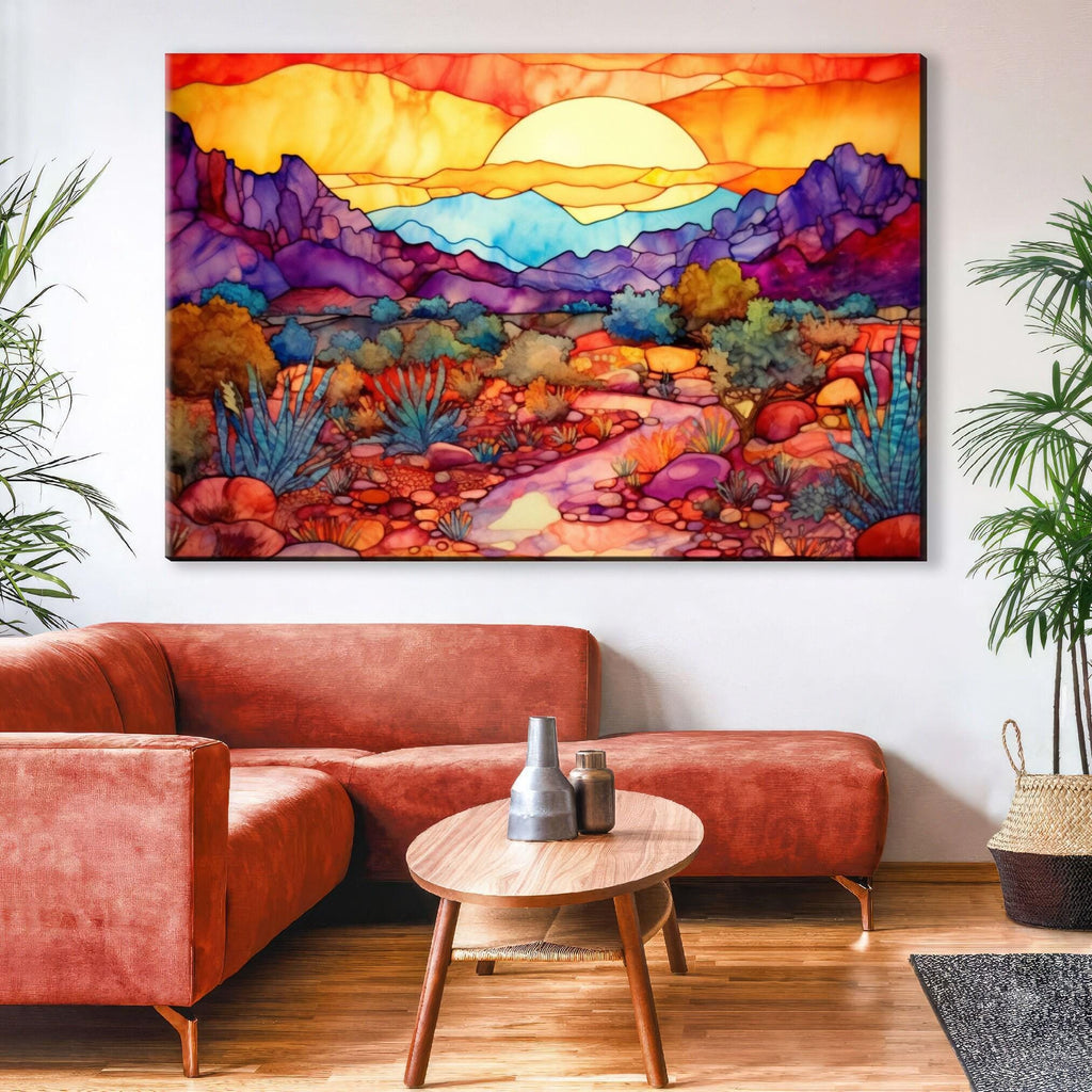 a large, colorful painting of a desert landscape hanging on a wall above a red sofa in a living room.