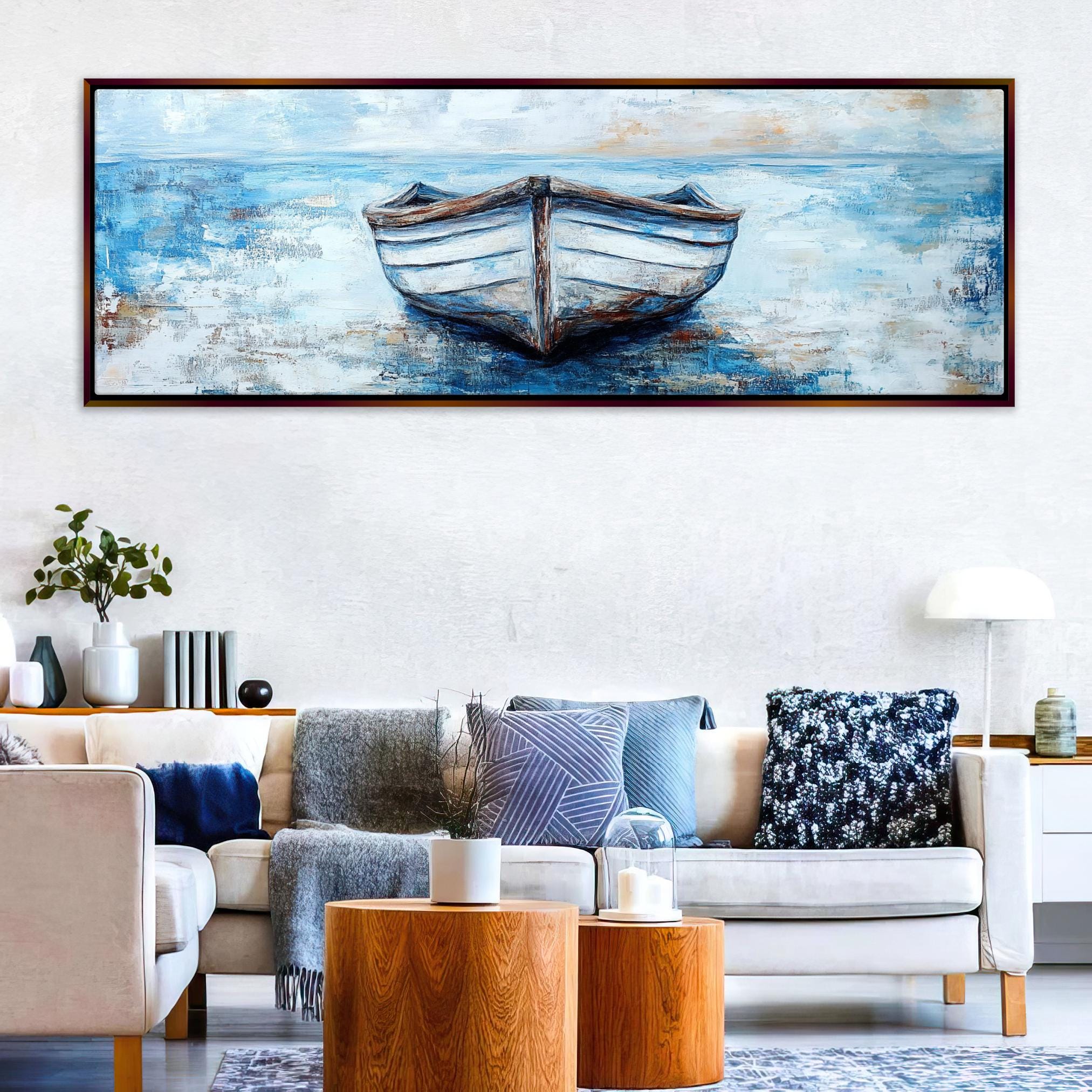 a living room with a couch and a painting on the wall