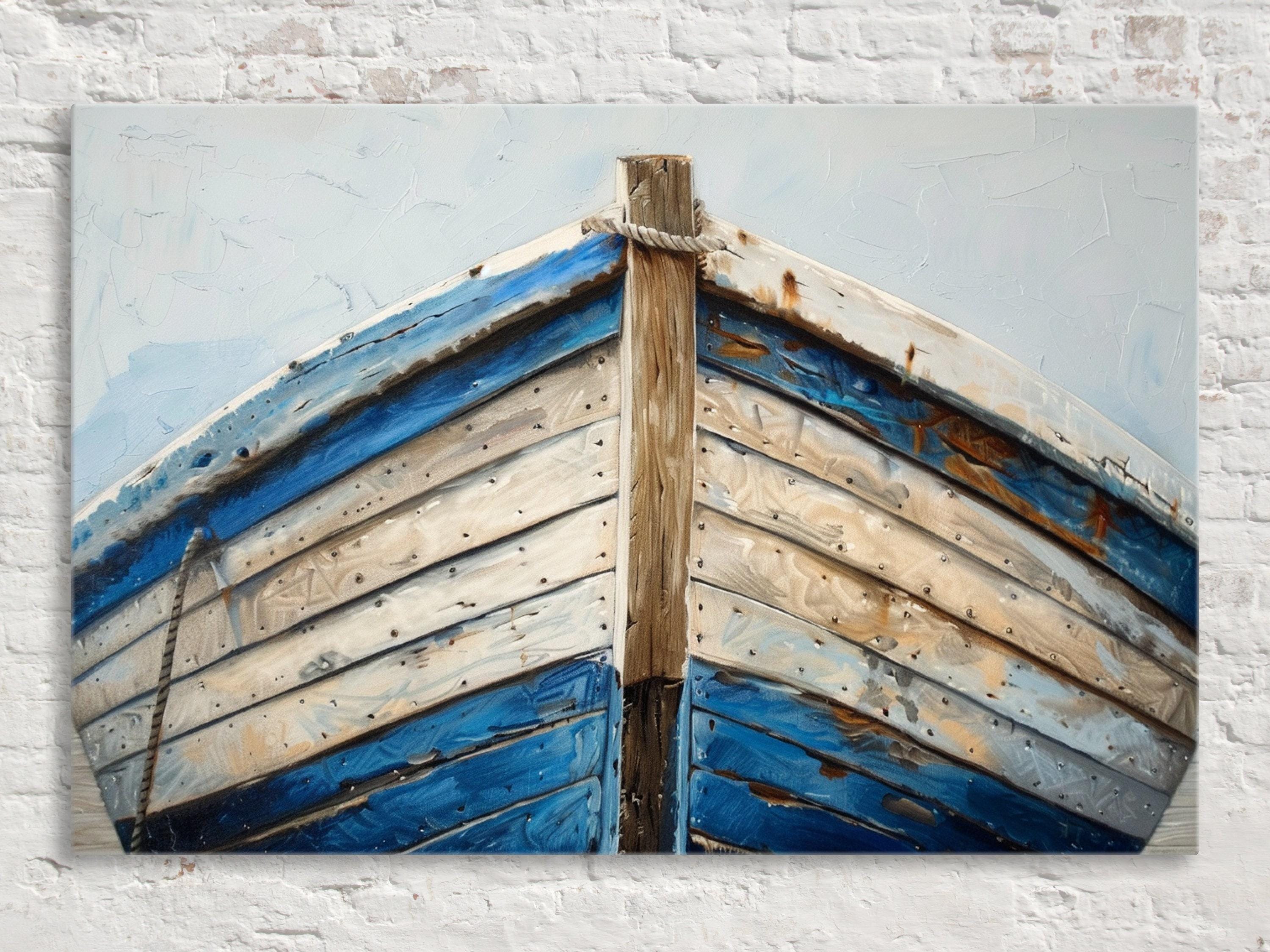A close-up view of the front of a blue and white wooden boat, with a rope tied to a wooden post.