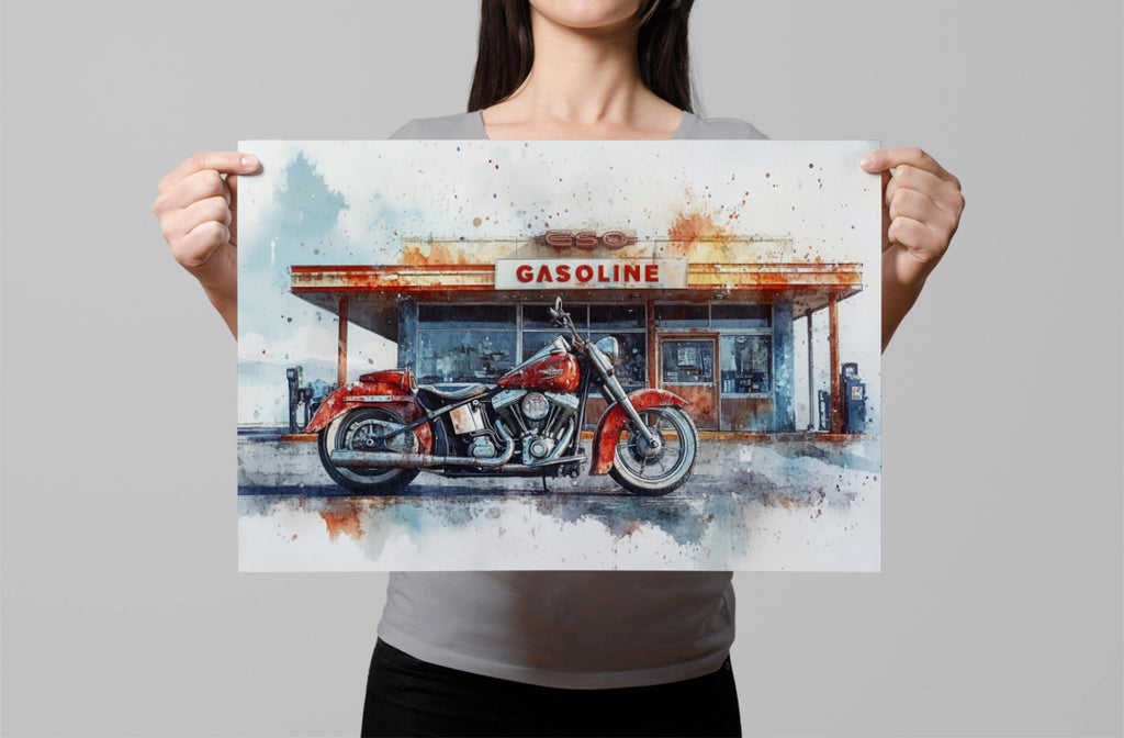 A woman holds up a framed print featuring a red motorcycle parked in front of a gas station.