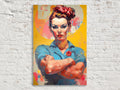 A colorful portrait of a woman with a serious expression, wearing a blue shirt and a red flower in her hair, standing with her arms crossed against a bright yellow background.
