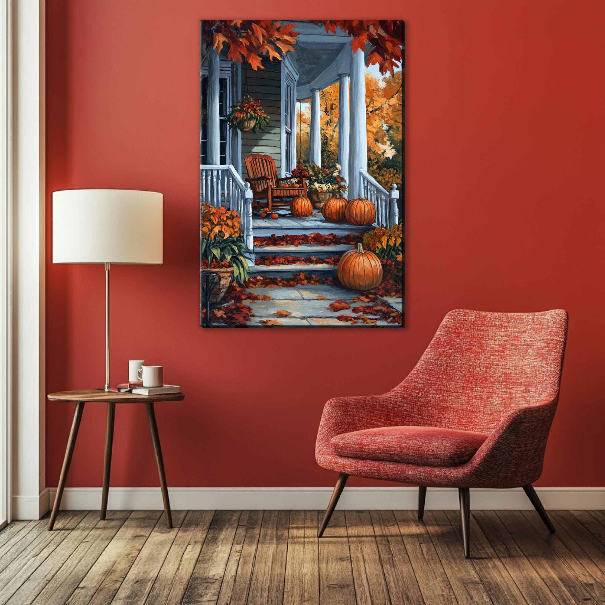 a cozy living room with a vibrant red wall, a wooden floor, and a comfortable red armchair. A wooden side table with a lamp and a coffee mug is situated next to the armchair. Above the armchair, a large painting of a porch with a white railing and a porch light is displayed on the wall, creating a warm and inviting atmosphere.