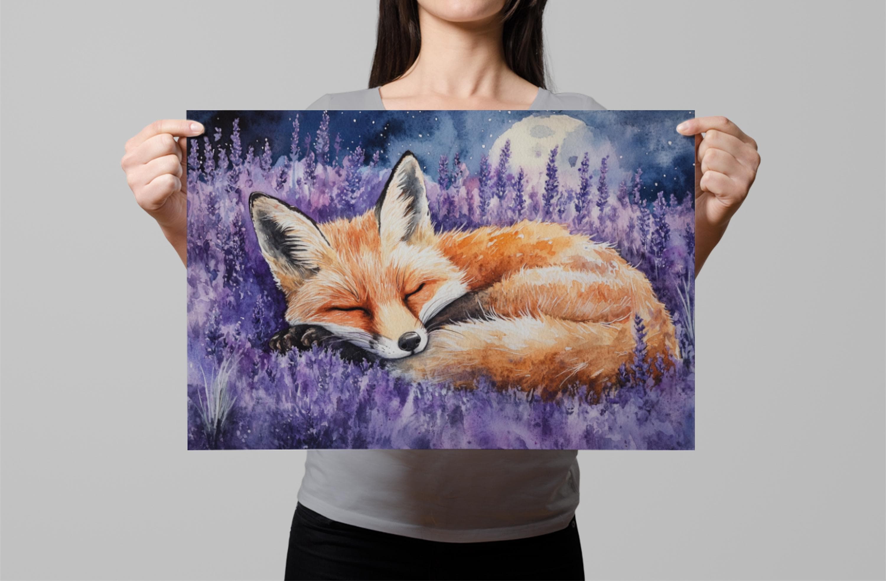 A woman holds up a framed painting depicting a sleeping fox in a field of purple flowers, with a full moon in the background.