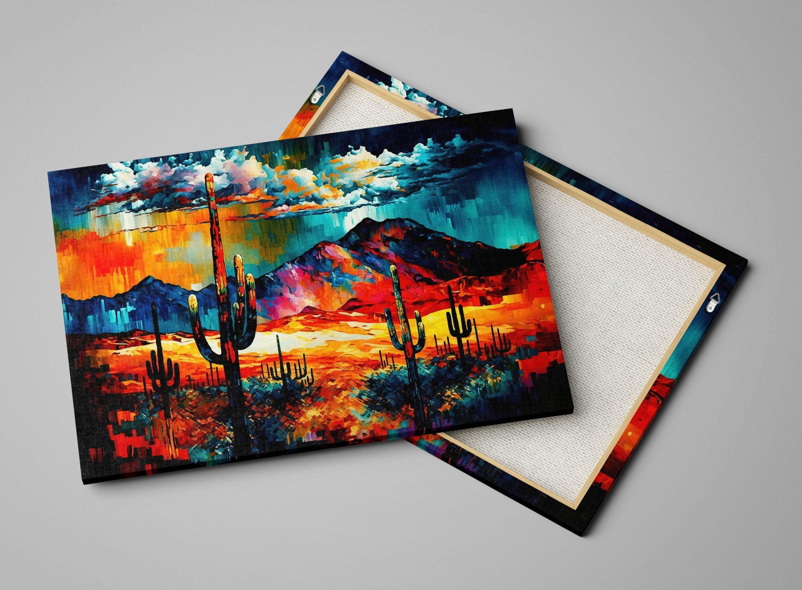 The image is a vibrant, colorful painting depicting a desert landscape with mountains in the background. The painting features a variety of warm colors, including shades of orange, red, and yellow, creating a lively and energetic atmosphere. The painting is framed and displayed on a white surface, showcasing the artist's skill and creativity in capturing the beauty of the desert scene.