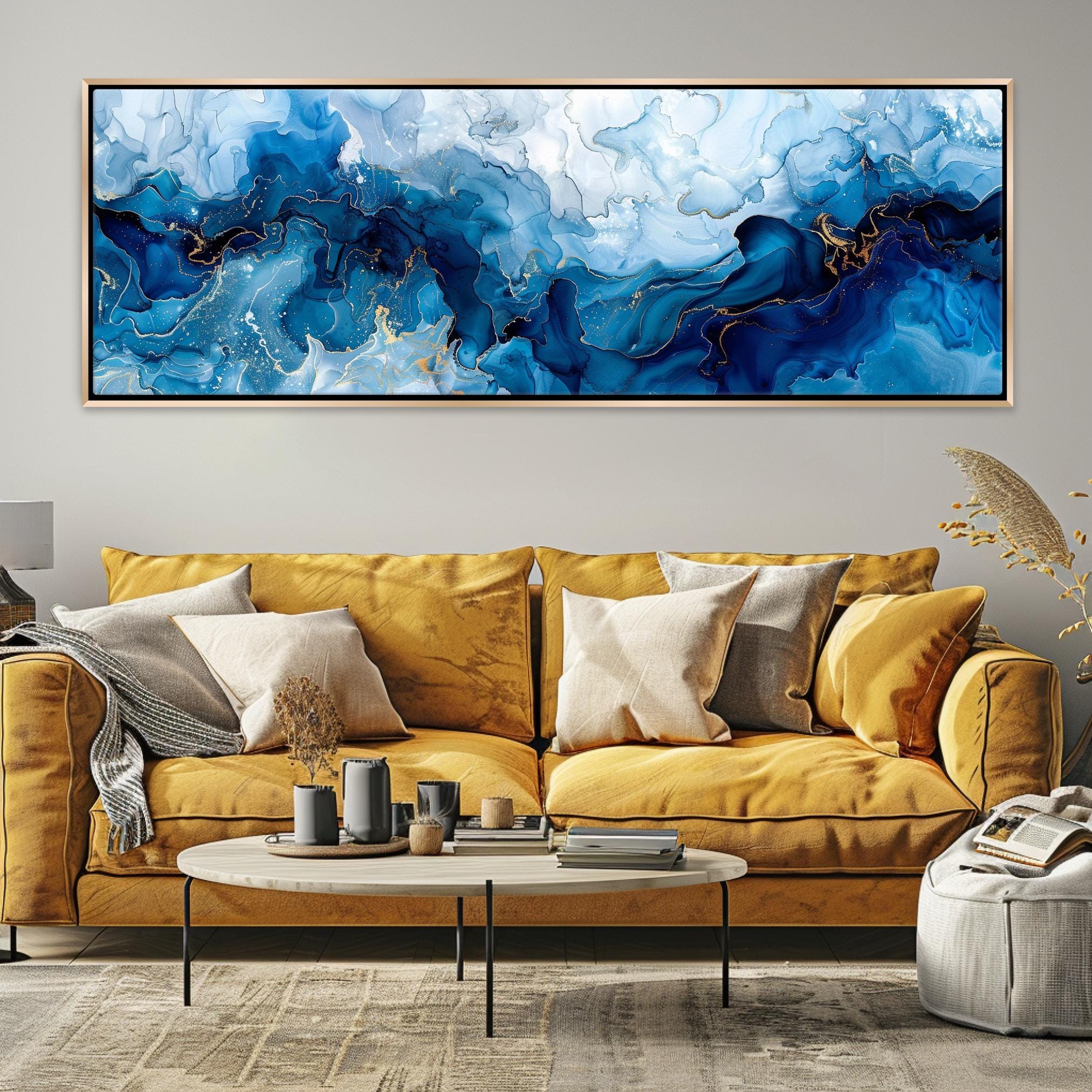 a living room with a yellow couch and a painting on the wall