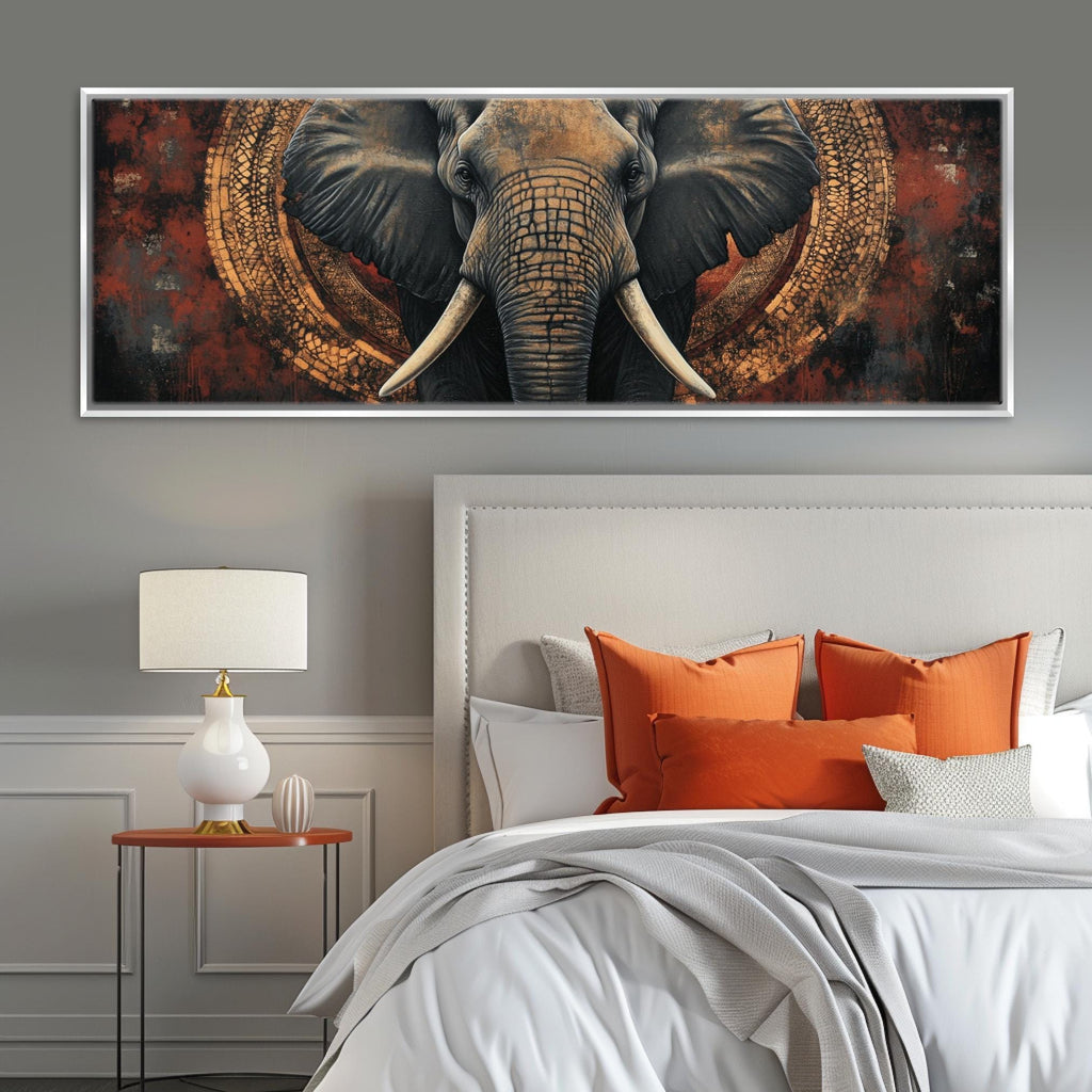 a picture of an elephant on a wall above a bed
