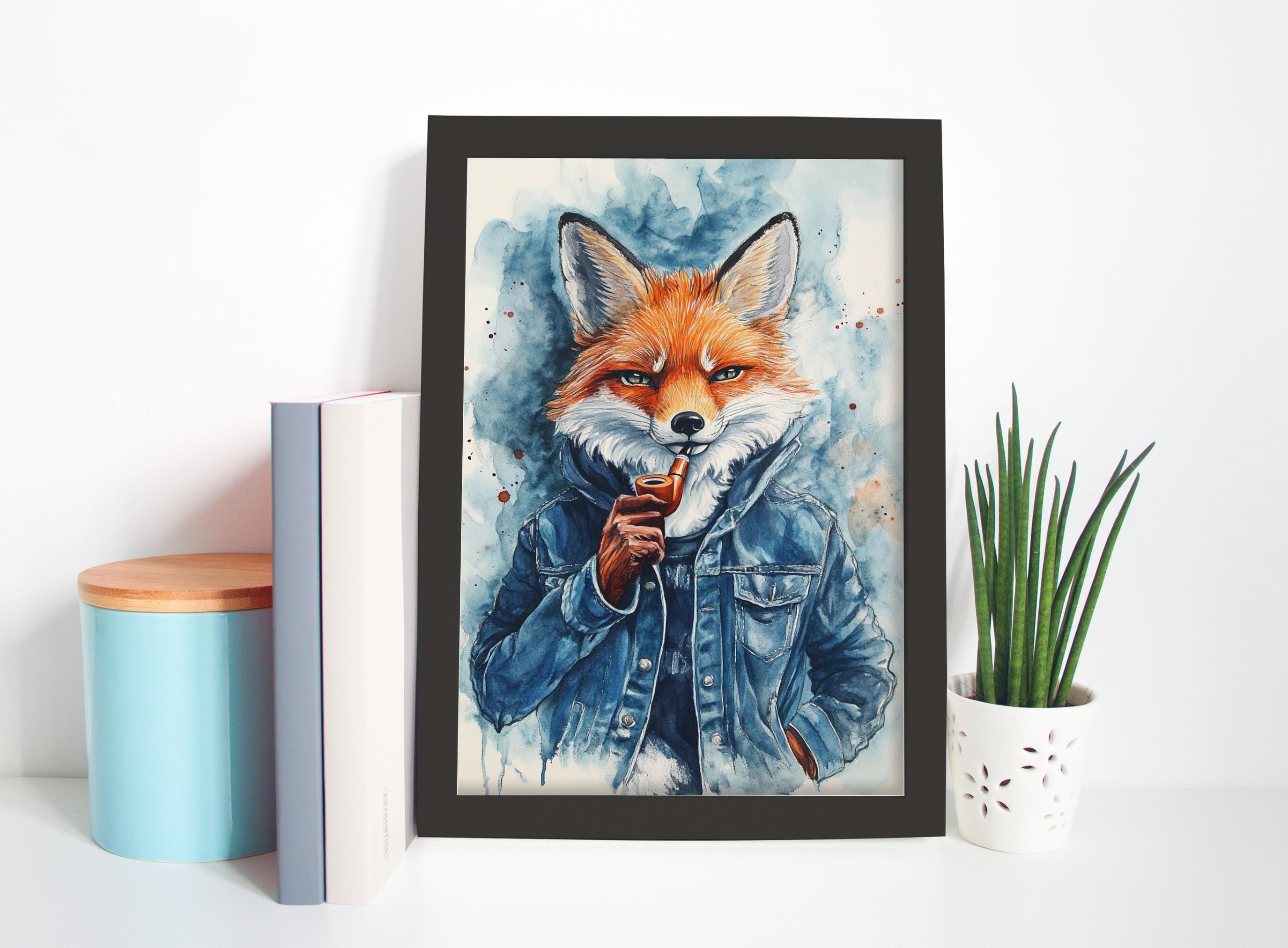 a framed painting of a fox wearing a denim jacket, with a potted plant and some books placed next to it on a shelf.