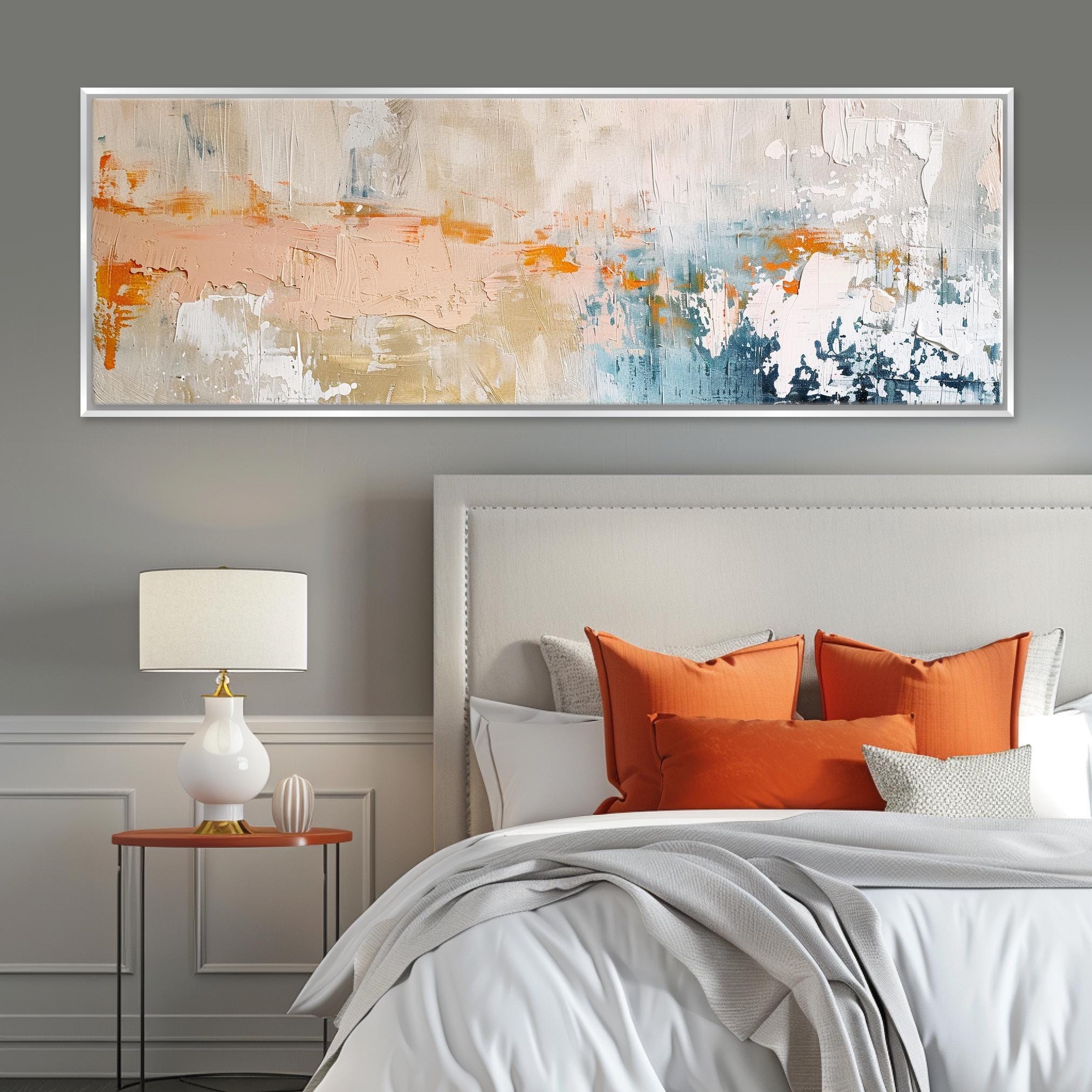 a bedroom with a large painting above the bed