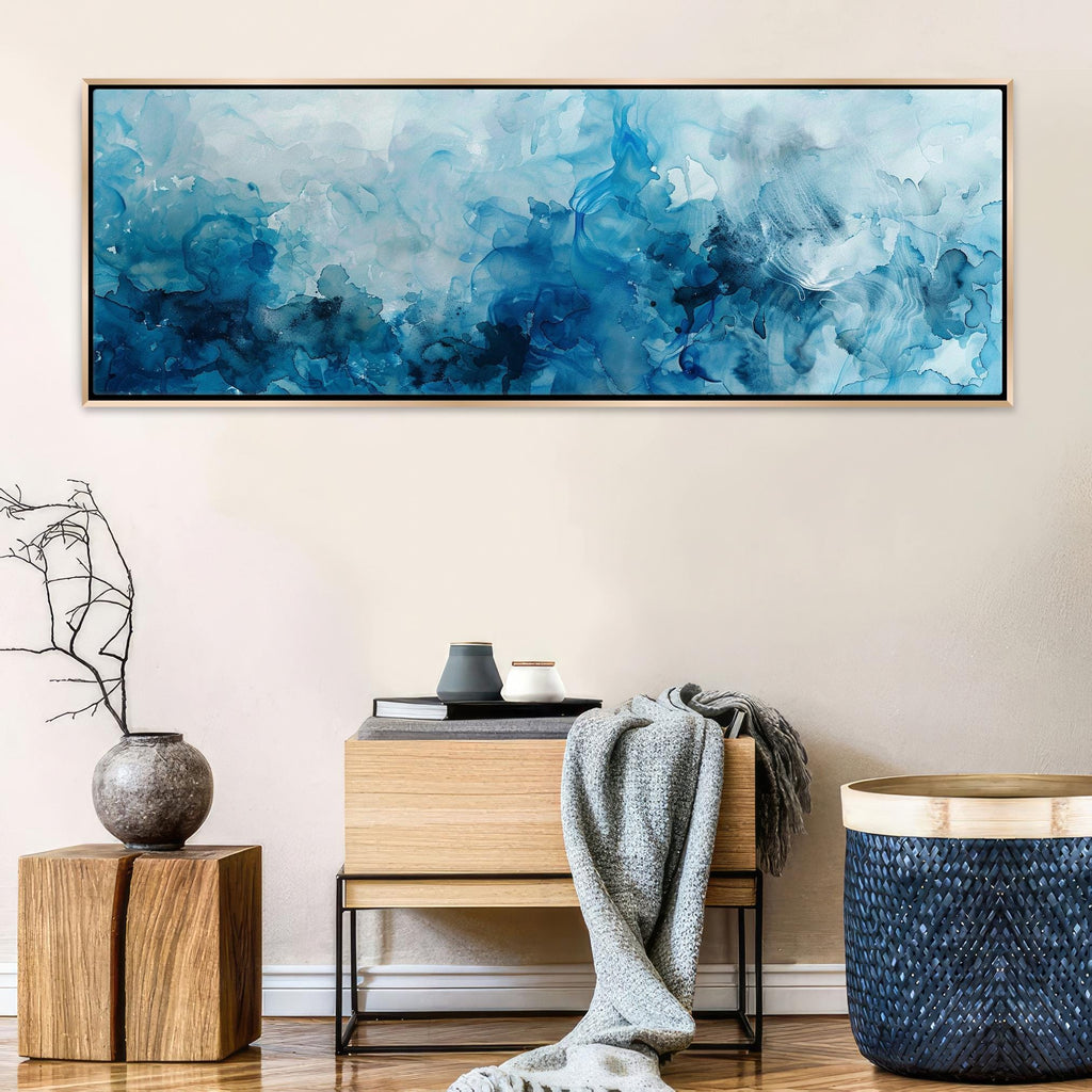 a painting hanging on a wall above a table