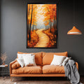 a cozy living room with a large orange couch adorned with white pillows, and a framed painting of a forest path with autumn foliage hanging above it.