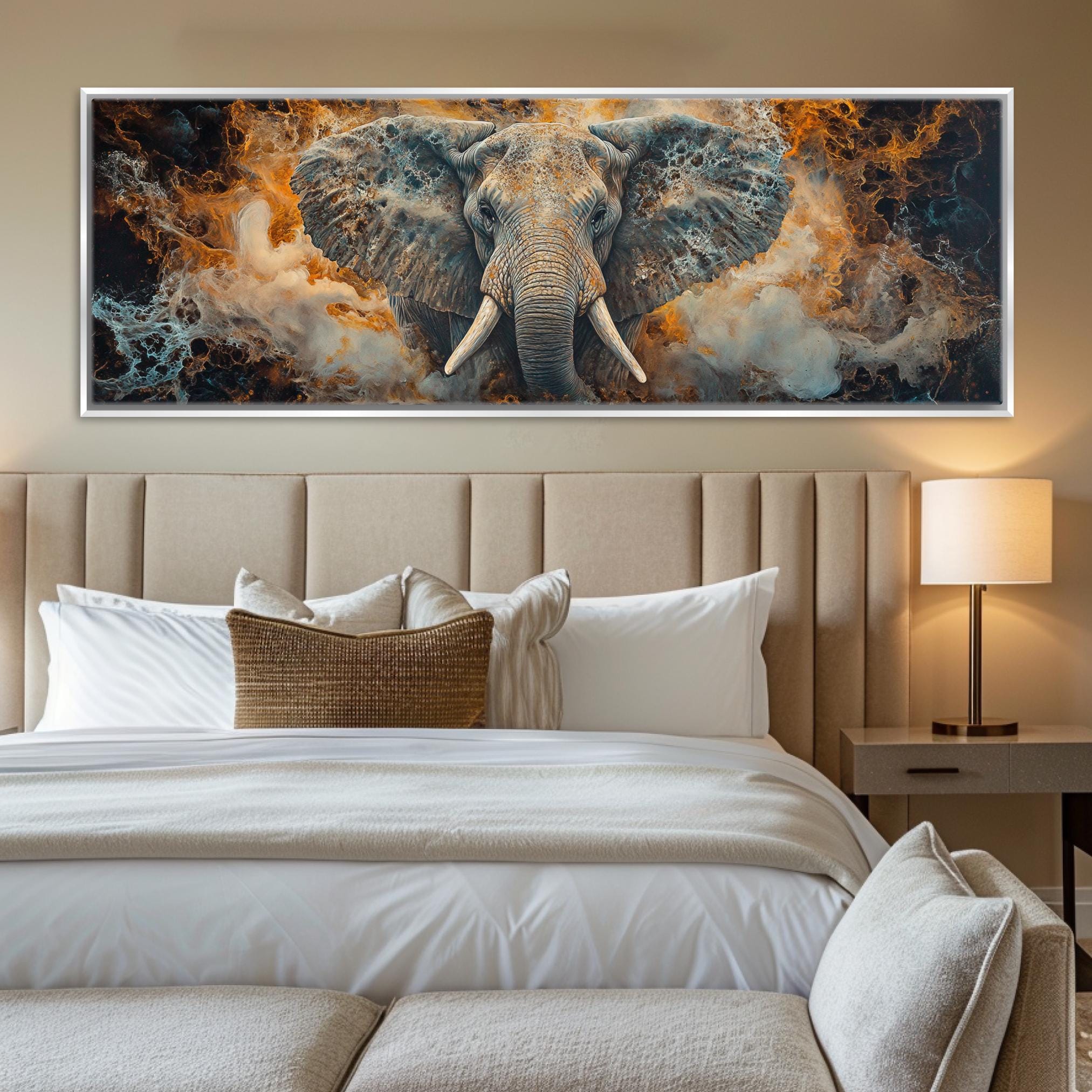 a large painting of an elephant on a wall above a bed