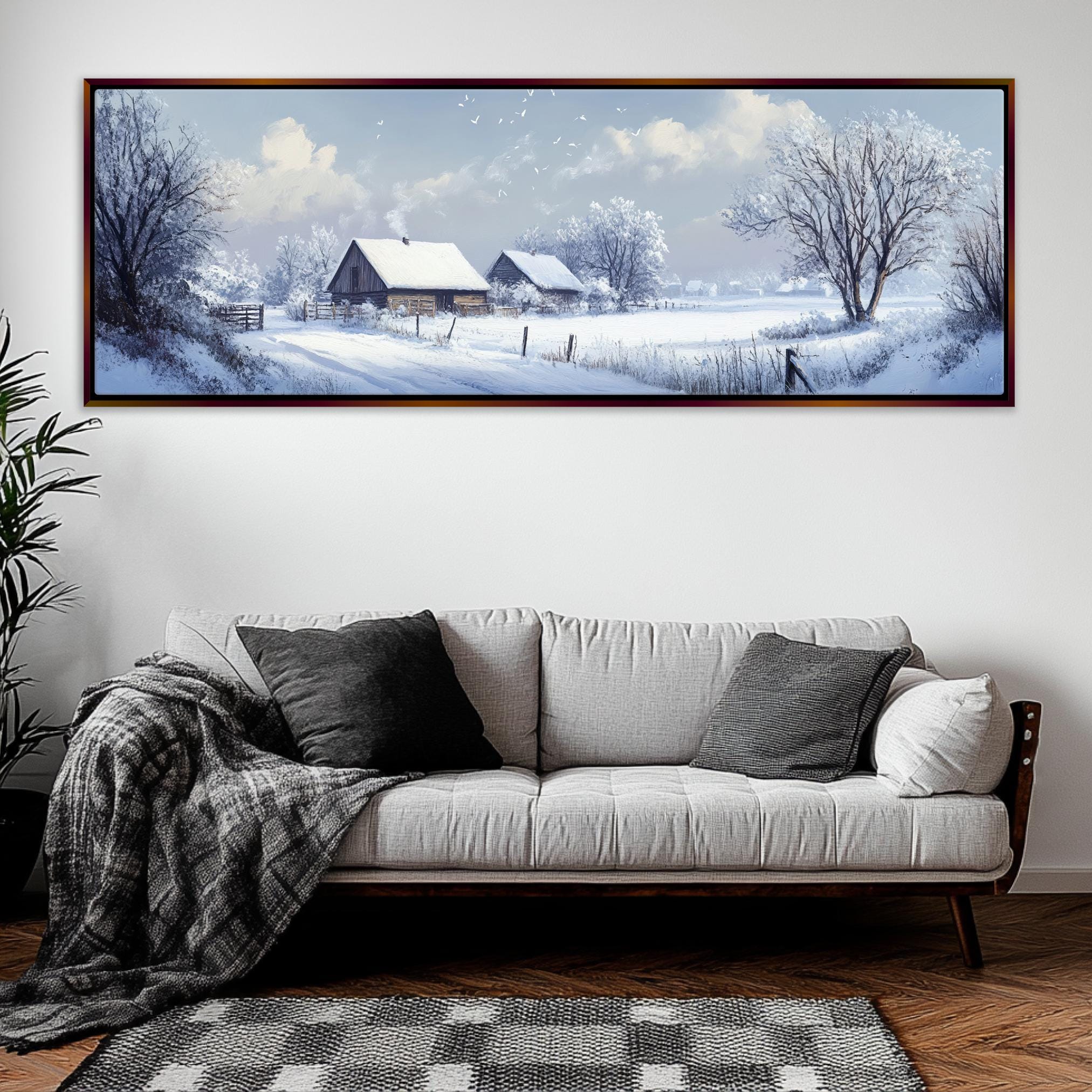 a living room with a couch and a painting on the wall