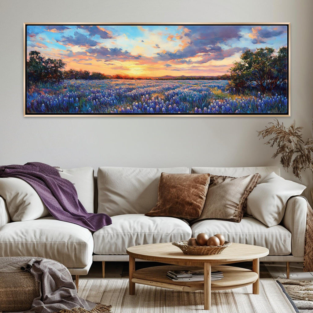 a living room with a white couch and a painting on the wall