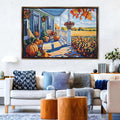 a cozy living room with a large painting of a porch scene hanging on the wall. The painting features a porch with a railing, a rocking chair, and a table with a vase of flowers. The porch is decorated with pumpkins and other fall foliage, creating a warm and inviting atmosphere. The room is furnished with a couch, a coffee table, and a lamp, contributing to the overall comfortable and welcoming ambiance.