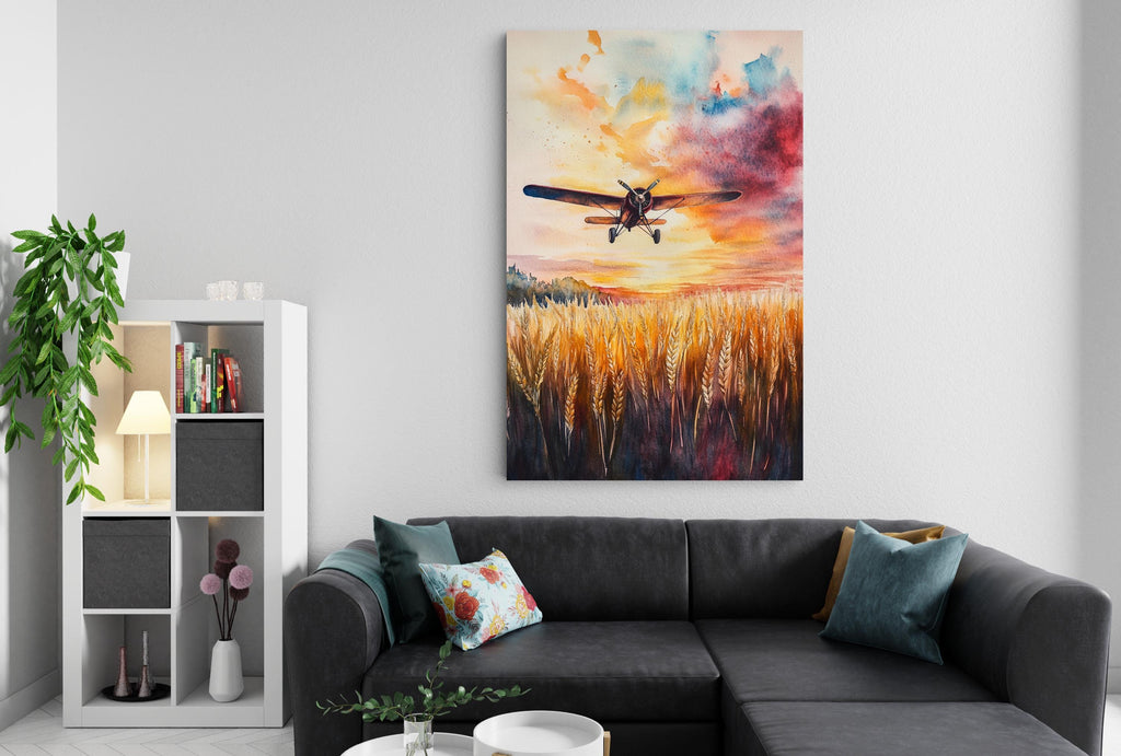 a cozy living room with a large painting of a plane flying over a field of golden wheat hanging on the wall. The room is furnished with a black sofa and a bookshelf, creating a comfortable and inviting atmosphere.