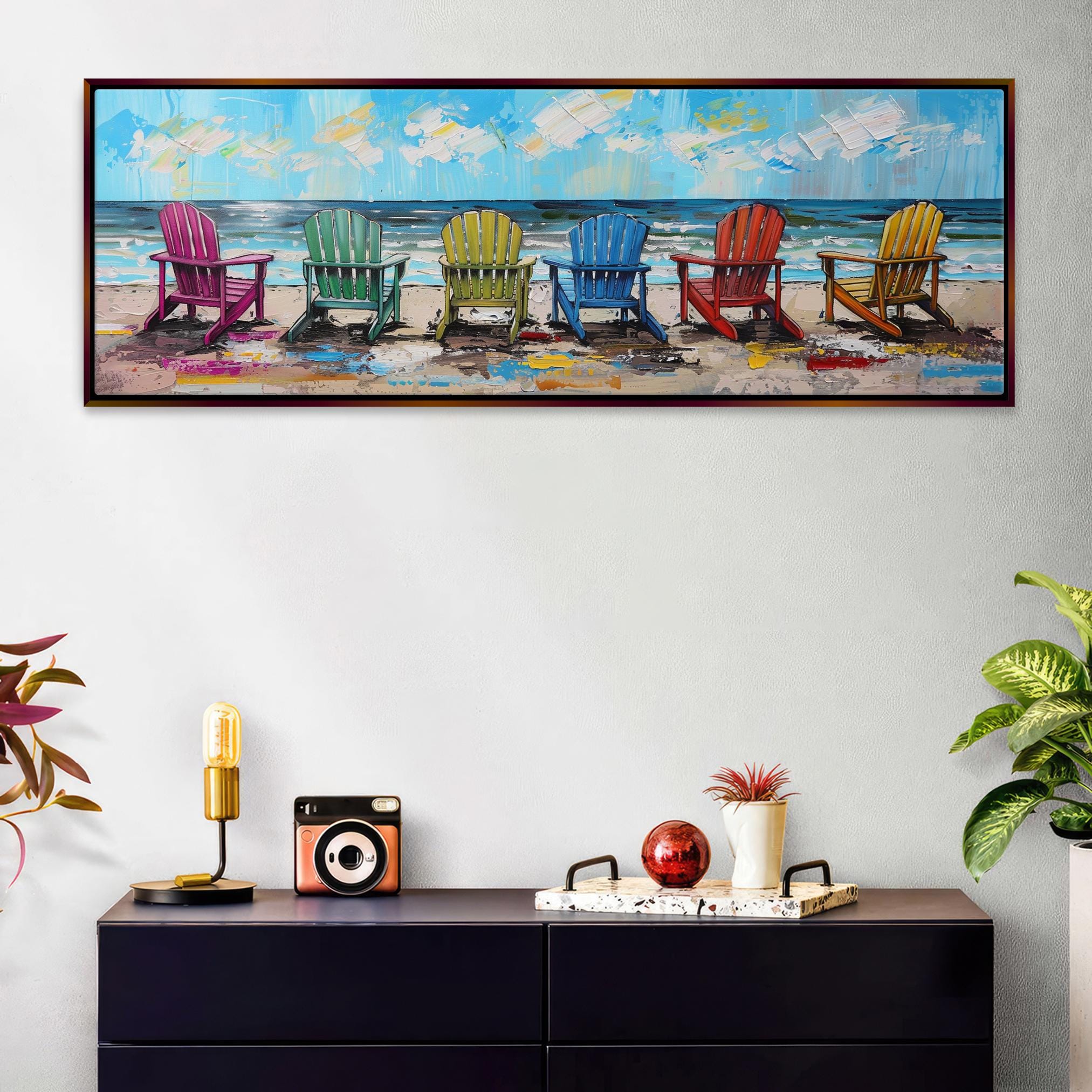 a painting of four beach chairs sitting on a dresser