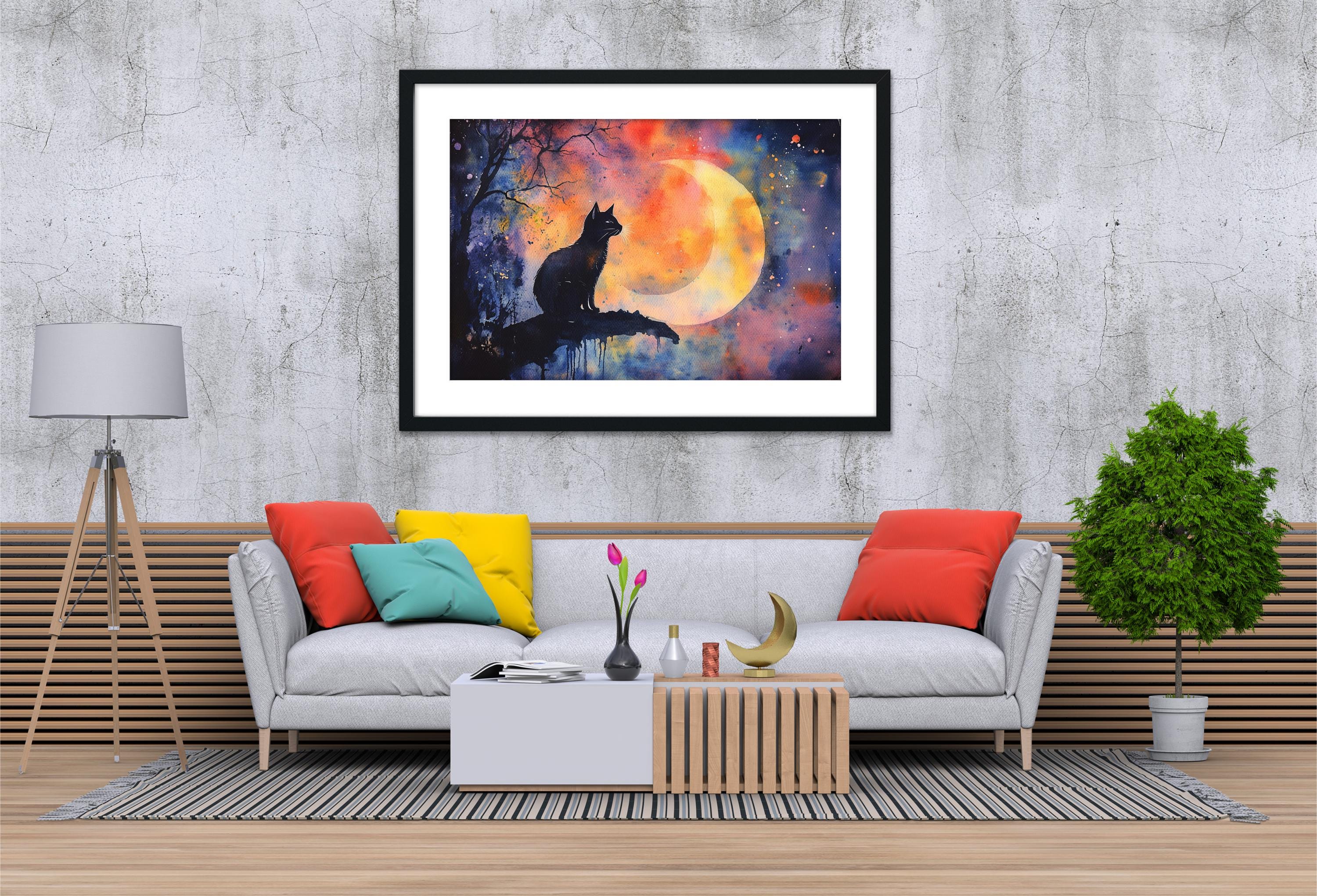 a living room with a gray sofa, a wooden coffee table, and a framed painting of a cat sitting on a rock under a full moon.