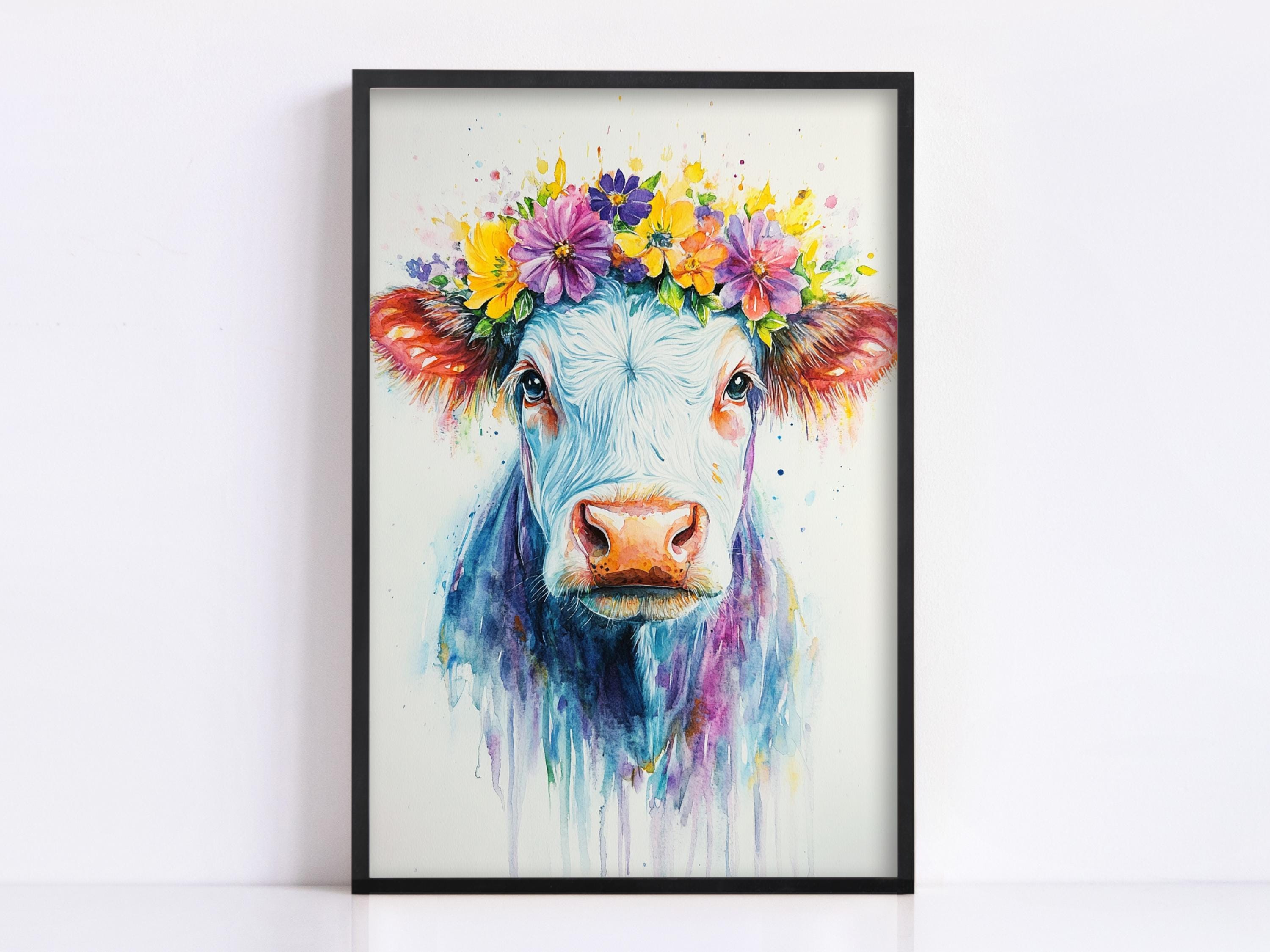 A framed painting of a cow with a colorful flower crown on its head.