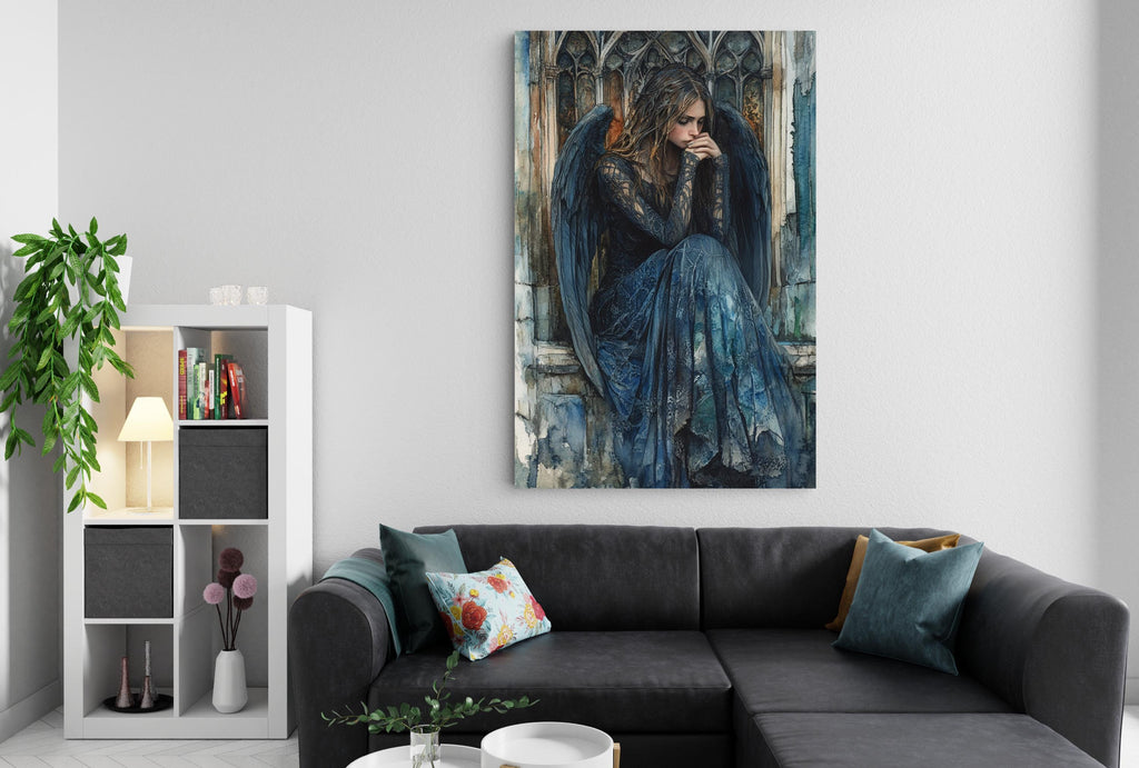 a large painting of a woman with wings, hanging on a wall above a black couch with throw pillows.