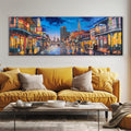 a living room with a couch and a painting on the wall