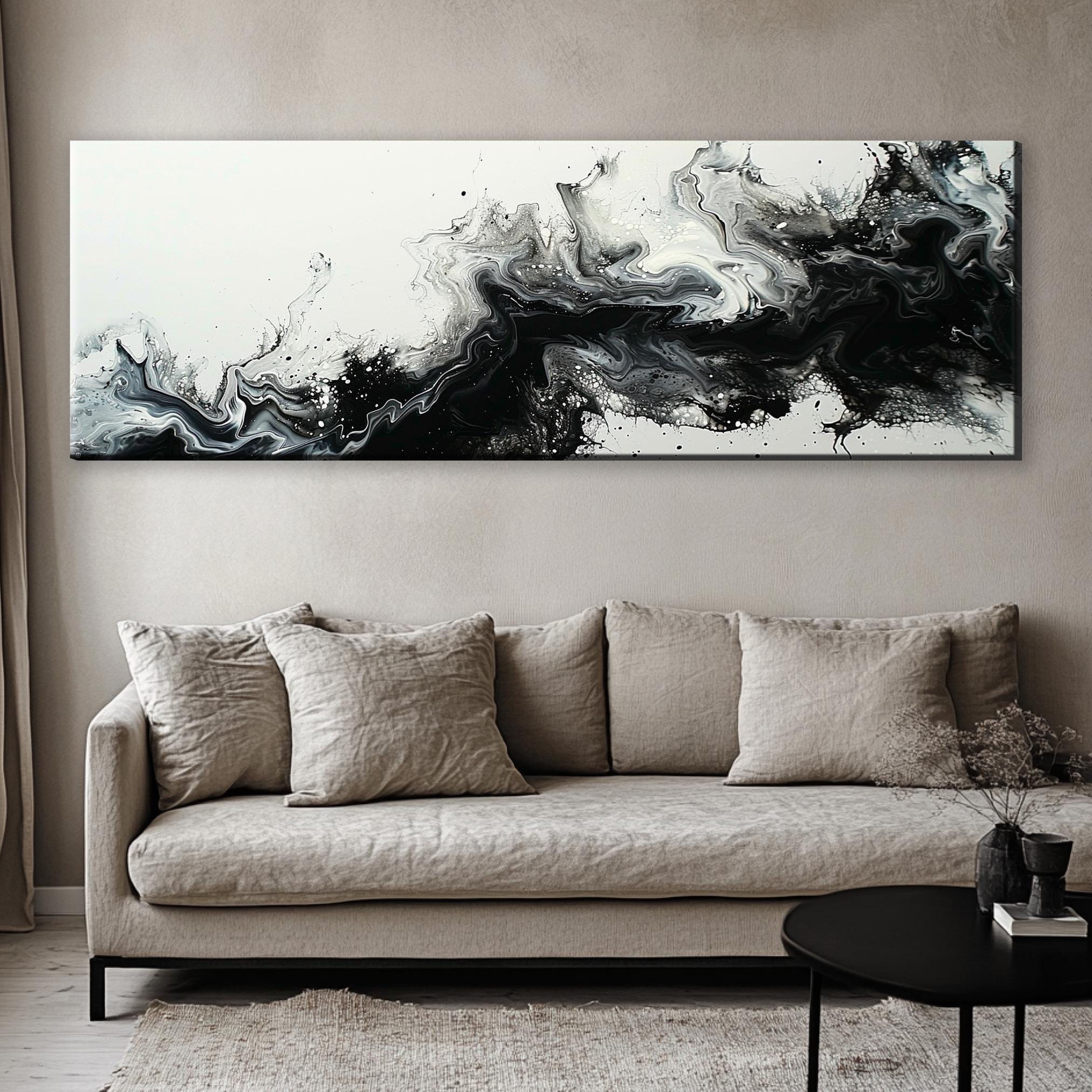a living room with a couch and a painting on the wall