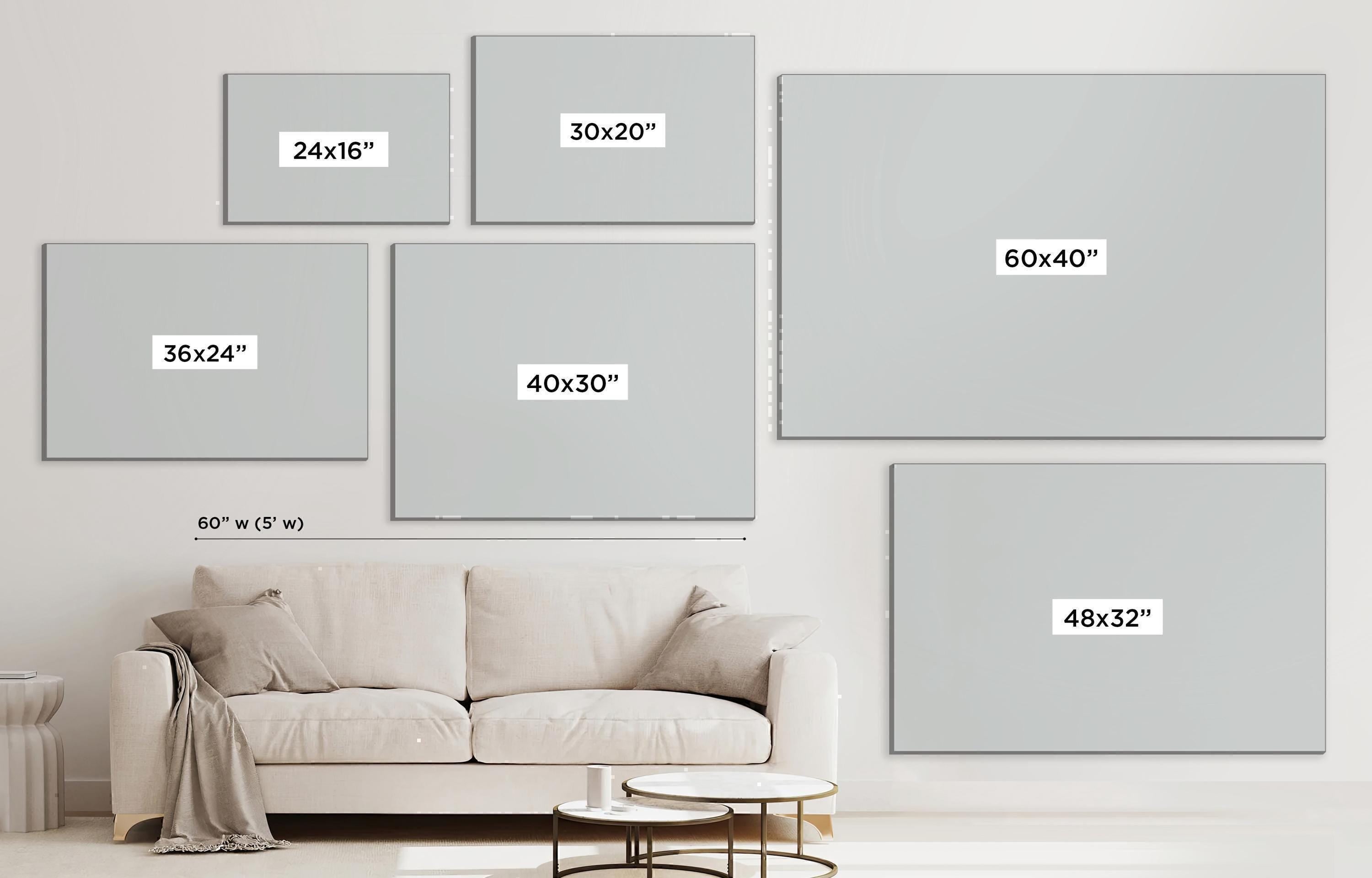 a living room with a white couch and a white wall